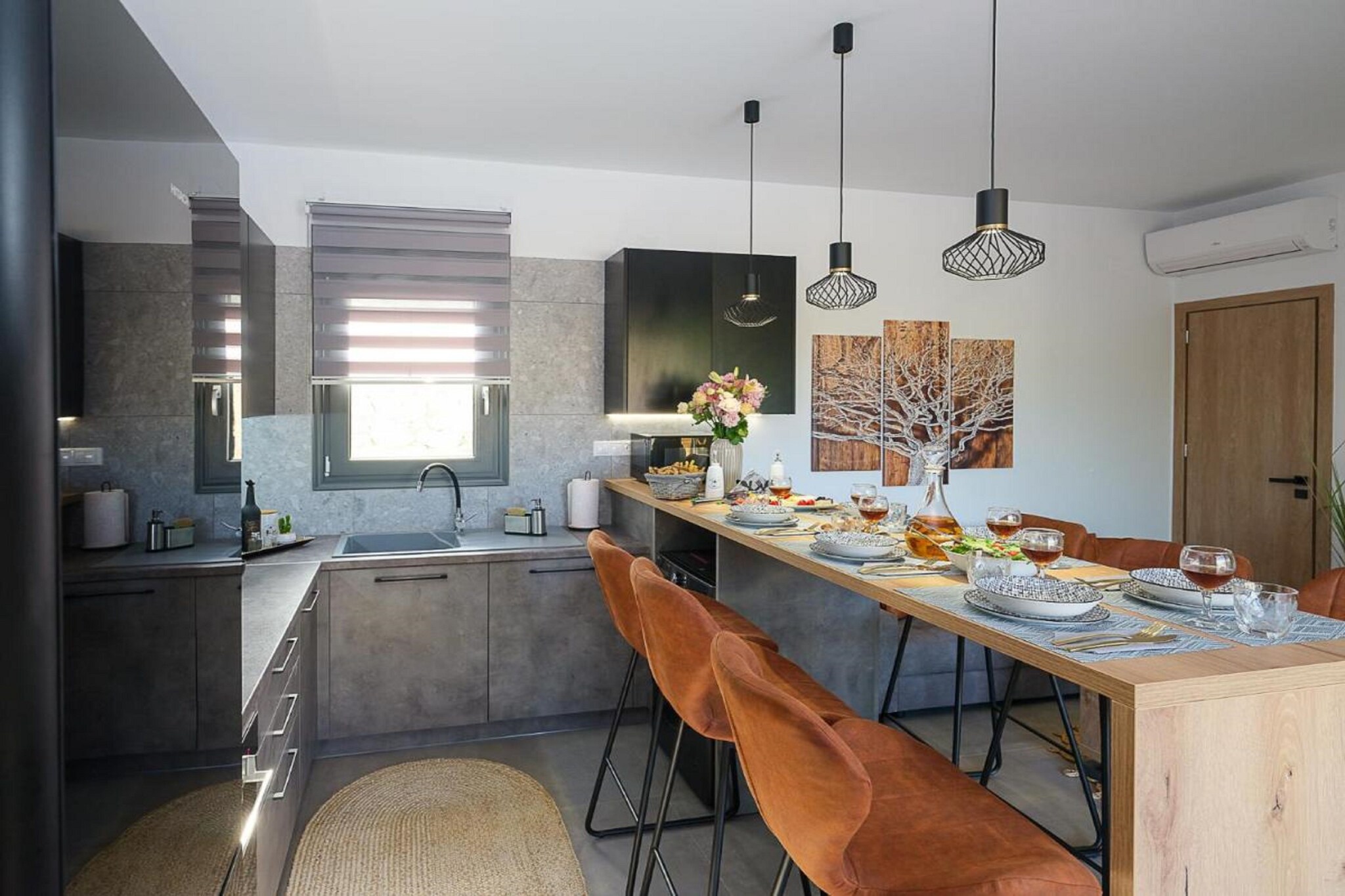 On the 1st floor: (Living room(TV, seating area), open kitchen(dining table, hob, electric kettle, hood, coffee machine, oven, fridge-freezer, air conditioning), bedroom(double bed, air conditioning), bedroom(double bed, air conditioning), bedroom(double bed, air conditioning), bathroom(shower, washbasin, toilet), bathroom(shower, washbasin, toilet), bathroom(shower, washbasin, toilet), Internet access)\n\ndining table, terrace, sun loungers, BBQ, parking, swimming pool(private), awning, baby crib(free)