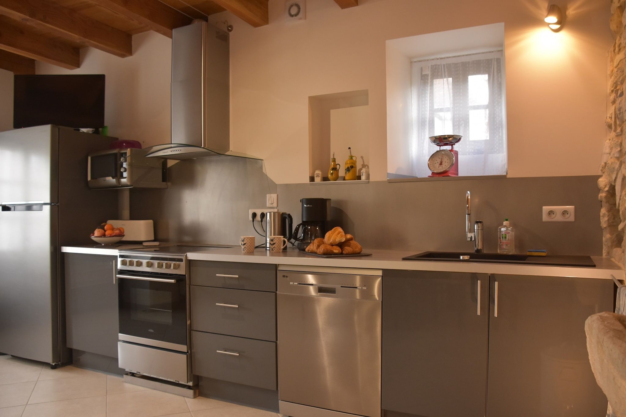 Ground floor: (Kitchen(dining table, cooker, hood, coffee machine, espresso machine, grill, combination microwave, fridge-freezer, washing machine, high chair, Blender))\n\nOn the 1st floor: (Living room(TV, seating area), bedroom(double king size bed), bedroom(double king size bed), bedroom(double bed), bedroom(double king size bed), bathroom(bathtub or shower, washbasin, toilet, bidet))\n\ncourtyard, terrace, garden furniture, BBQ, parking lot(public), deckchairs