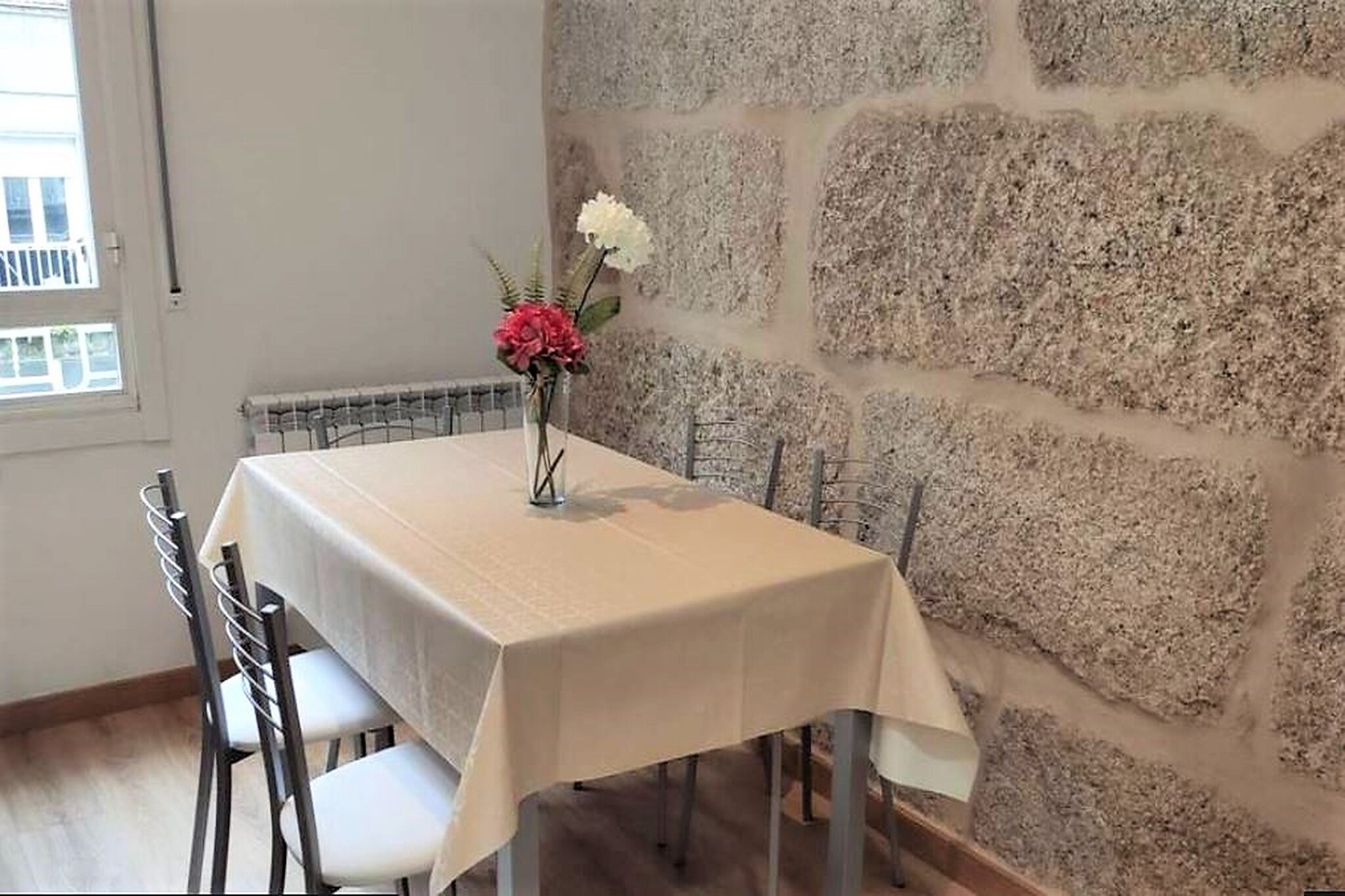 Revel in the beauty of the glorious Green Spain as you comfortably reside in this stellar apartment in Ourense with a great view of the city. The home has free Wi-Fi and is based in a central location. It is ideal for city trips with family or friends.

Ourense, the city of hot springs, is located in the not so tourist west of Spain, not far from the border with Portugal. Visit the hot springs at AS Burgas and make beautiful, Insta-worthy photos at the Puente Romano. Ourense is a pleasant city with good restaurants and wine. The thermal baths of Outariz are 6 km from the apartment and are definitely worth a visit.

The property has a private balcony or terrace and a fully-equipped kitchen with a dishwasher. The living/bedroom is attractively decorated and you can jointly dine at the dining table. Moreover, there is a TV with a comfortable seating area.

The nearest airport is Vigo 90 km from Villa Trabazos Abellas. Parking is available 40 metres from the accommodation (costs may fluctuate).

About Belvilla

When you stay in a Belvilla home, you can rest assured of a unique holiday home in ideal surroundings at an attractive price. The portfolio of accommodations consists of more than 40,000-holiday homes in 20 European countries. Interested in a weekend getaway, a summer or winter sports holiday or simply a short break? Do you prefer the coast, the countryside or the mountains? Whatever your preference, there is a Belvilla home to meet your needs, from a cosy gîte for two to a castle big enough for the entire family, from an apartment in the heart of Rome to a cabin in the middle of nowhere, from a simple tree house to a luxury dream villa and from close to home to the other side of Europe.

A Belvilla home gives you the freedom to enjoy breakfast in your pyjamas or continue a good conversation into the morning hours without having to worry about the bar's closing time. Prepare gourmet meals with fresh local ingredients in your own kitchen and take advantage of having your own swimming pool to do as many cannonballs as you want! In other words, you can enjoy complete privacy in your home away from home.