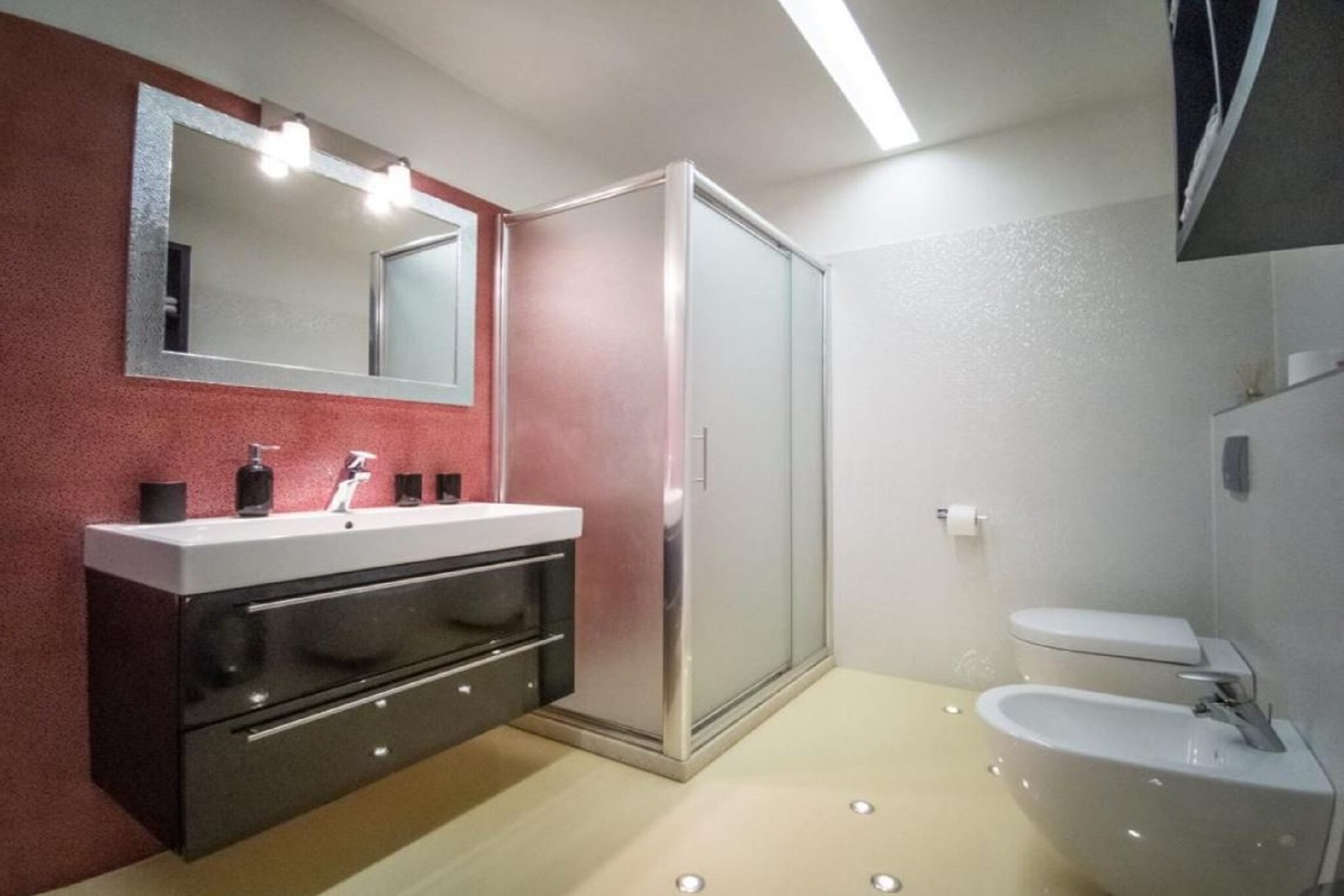 Ground floor: (Kitchen(hob, electric kettle, hood, coffee machine, oven, microwave, fridge-freezer, washbasin), Living/diningroom(TV, dining table), bathroom(shower, washbasin, toilet, bidet, washing machine), bathroom(shower, washbasin, toilet, bidet), patio)\n\nOn the 1st floor: (bedroom(double bed, double sofa bed), bathroom(shower, washbasin, toilet, bidet))\n\nAttic: (bedroom(double bed or 2 single beds), bedroom(double bed or 2 single beds))\n\nhot tub, garden, garden furniture, sun loungers, BBQ, parking
