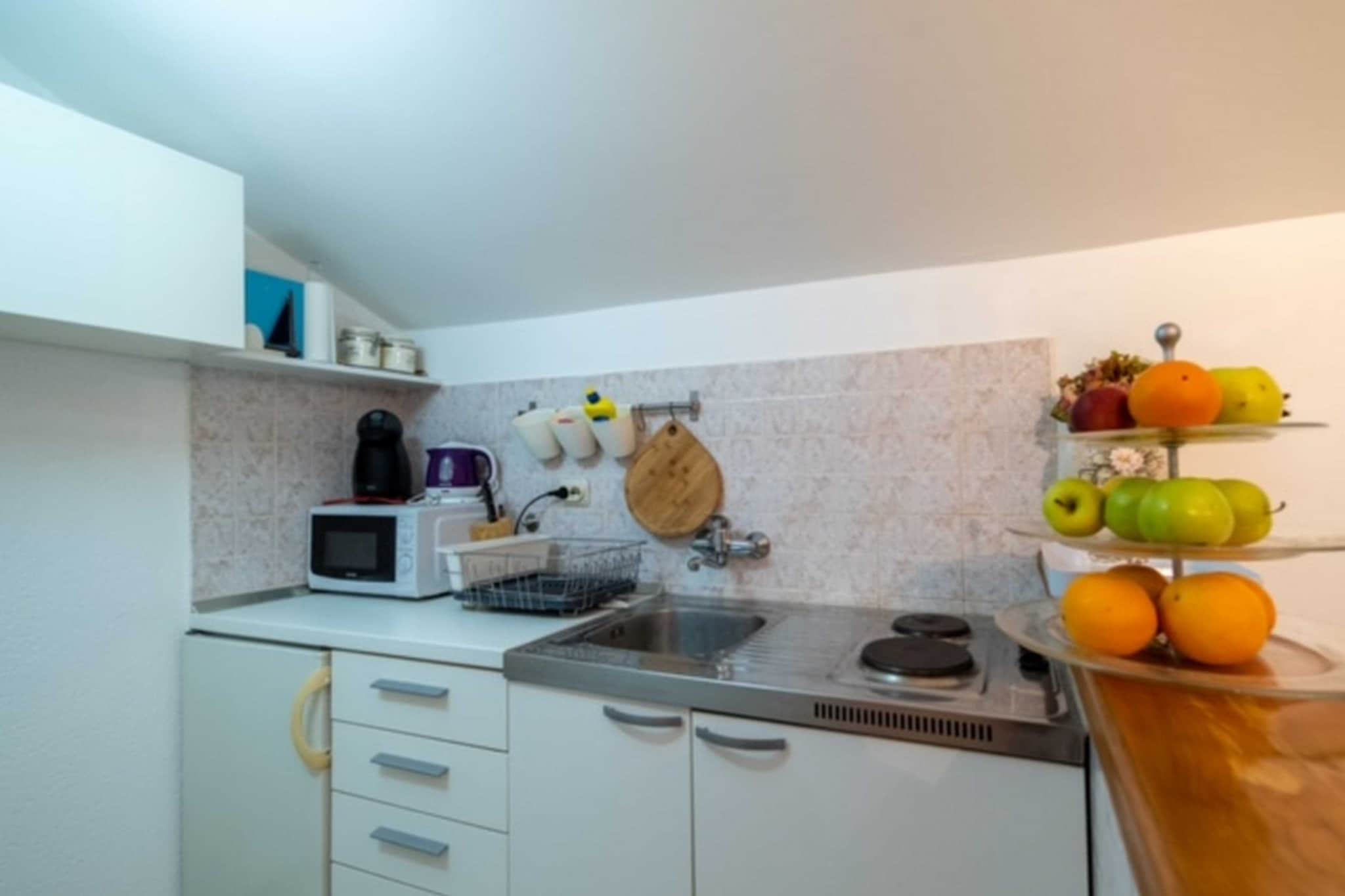 On the 1st floor: (Living room(double sofa bed), Kitchen(stove, electric kettle, oven, microwave, fridge), bedroom(double king size bed), bathroom(bath tub, shower))\n\ntoilet, TV, dining table, washing machine, patio, air conditioning, parking, hairdryer