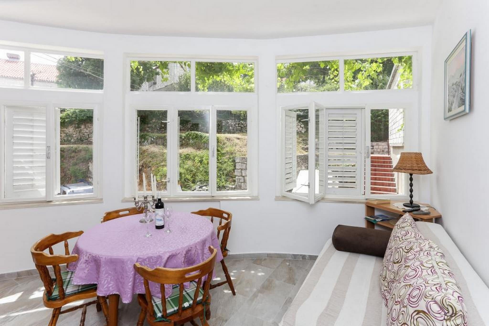 Apartments Sisic, feature self-catering accommodation units located in Lapad area,  Dubrovnik, just a 10 minute bus ride from Dubrovnik Old Town

Private parking available, reservation is required.

This one bedroom apartment comes with air conditioning, free WiFi, seating area, dining area and kitchen with oven and stove top. Other features include a private bathroom with  hair dryer and terrace.

The street Iva Vojnovica offers a selection of restaurants, lovely outdoor and indoor cafes, shops and a bakery only meters away. A bus stop with lines going to the Old Town is 200 meters away.  While staying at the accommodation guests can visit both the Old Town, and stroll down to the lovely Lapad Promenade located just 700 meters from the apartment. The closest beach is 1 km away.

Dubrovnik's Main Bus Station and Ferry Port, connecting the mainland with various Dalmatian islands, are 2 km away, while Dubrovnik Airport is 22 km away.