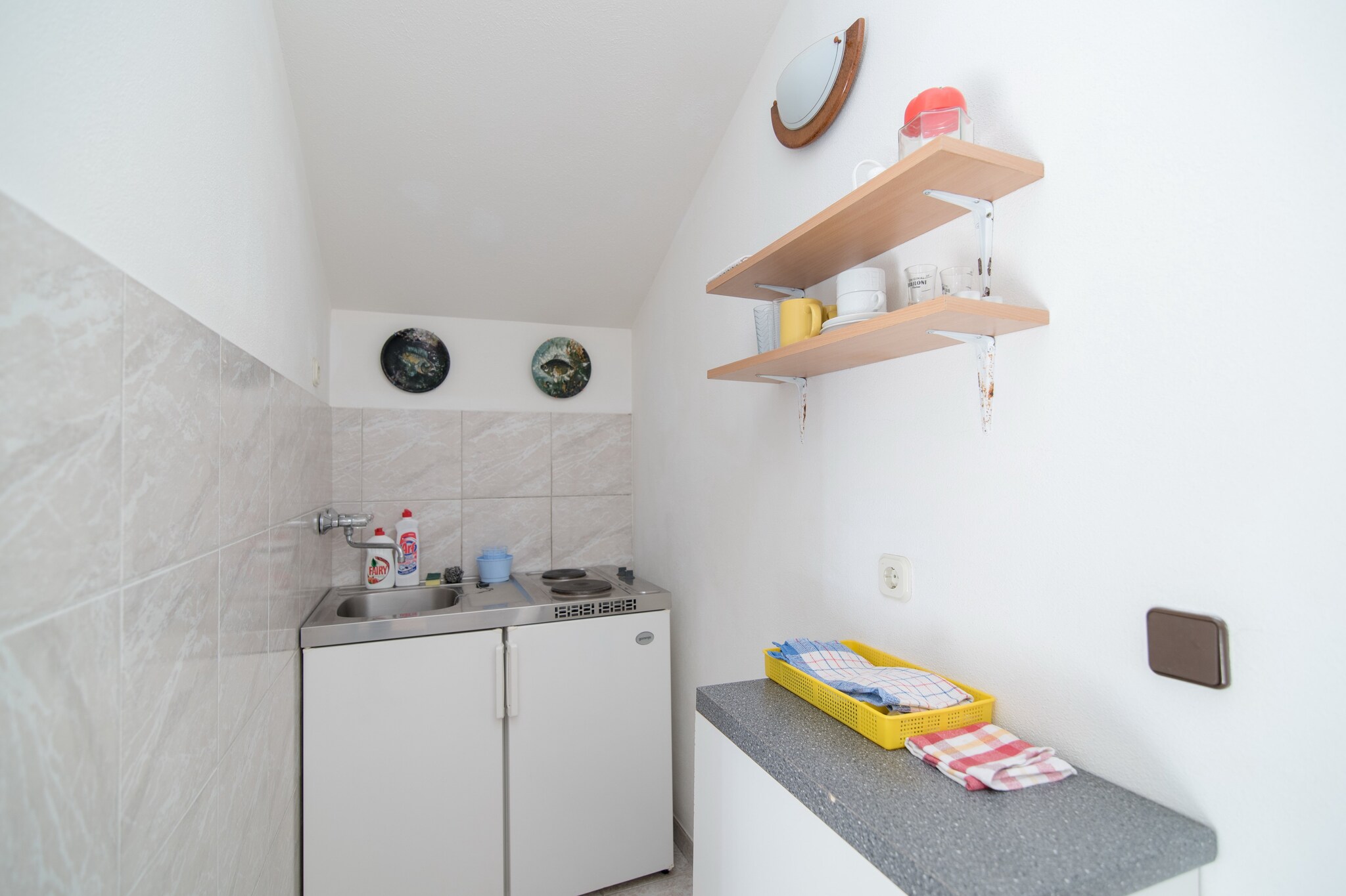 This apartments are situated in a place called Supetar, on a beautiful island of BraÄ a quiet Island with rich cultural and historical heritage, beautiful beaches and scenery, just 17 km away from the Split.
Luggage storage before check in and after check out are available, so that you can explore this island a bit more before departure.
Pets are not allowed.
Free private parking on site.
This is a lovely studio apartment equipped perfectly for two people.
Studio features cable TV and free Wi-Fi. Kitchenette is well equipped and comes with dining table. Private bathroom offers shower and free toiletries.
To fully enjoy the beauty of the apartment there is a terrace with outdoor furniture overlooking the sea.
Perfect for spending your holidays with a beach only 220 meters away, a restaurant within the range of 100 meters and a market at a 150 meters distance.
Post office and a bank are within the range of 300 meters, ambulance and pharmacy only 600 meters away.
Tourist info and a ferry bar are just 800 meters away and gas station as well as the bus stop are at a distance of 900 meters.
Airport is situated 25 km away.