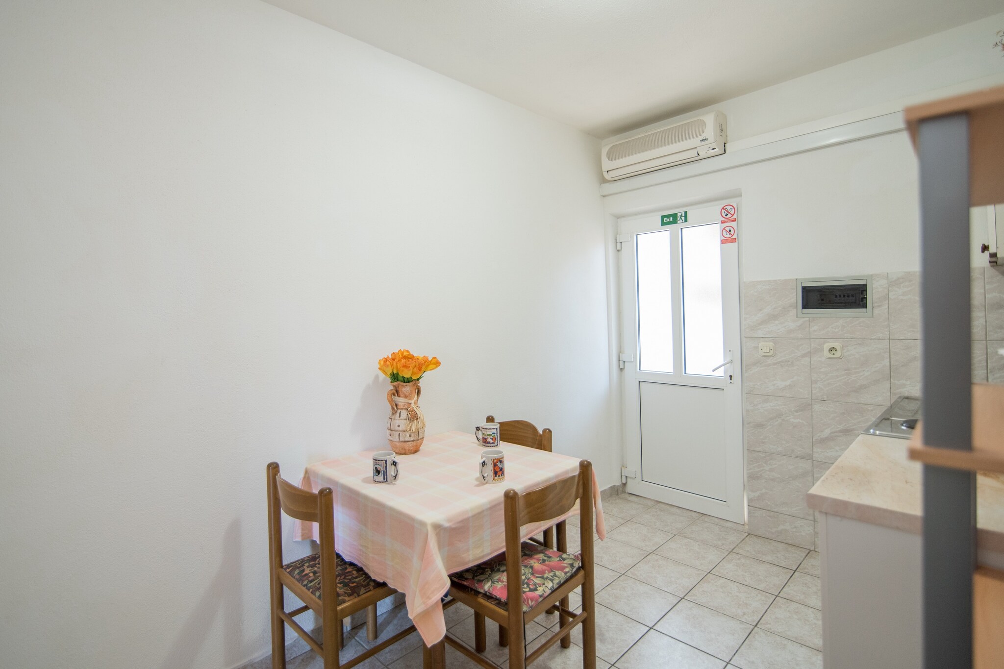 This apartments are situated in a place called Supetar, on a beautiful island of BraÄ a quiet Island with rich cultural and historical heritage, beautiful beaches and scenery, just 17 km away from the Split.
Luggage storage before check in and after check out are available, so that you can explore this island a bit more before departure.
Pets are  not allowed.
Free private parking on site.

This is a lovely economy two bedroom apartment is perfectly equipped for four people. 
It features air-conditioning, Wi-Fi and cable TV. There are two bedrooms with two queen size beds.
Kitchen is well equipped and comes with dining area. Private bathroom comes with a shower and free toiletries.
Beautiful terrace with outdoor furniture overlooking the garden is at guest disposal.

Perfect for spending your holidays with a beach only 220 meters away, a restaurant within the range of 100 meters and a market at a 150 meters distance.
Post office and a bank are within the range of 300 meters, ambulance and pharmacy only 600 meters away.
Tourist info and a ferry bar are just 800 meters away and gas station as well as the bus stop are at a distance of 900 meters.

Airport is situated 25 km away.