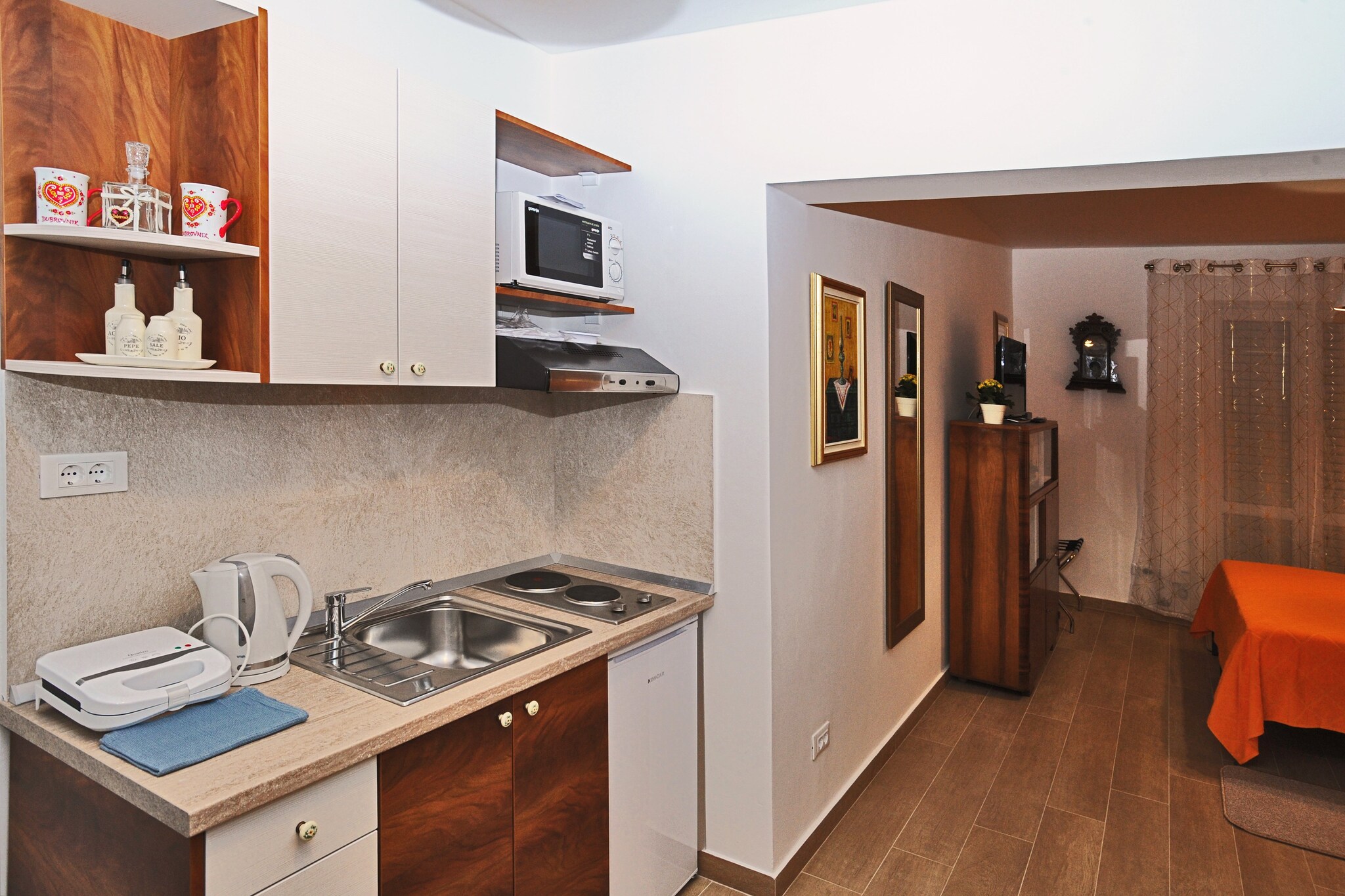 Nika Family Apartments are situated in a quiet neighborhood near Dubrovnik's Main Bus Station and Ferry Port, connecting the mainland with various Dalmatian islands. Apartment's location is perfect for getting  to know undiscovered areas of Dubrovnik. All units have a private bathroom, kitchenette and air conditioning.

*** FACILITY ACCESS ***
The Address "Od Gaja 70, 20000 Dubrovnik" is recommended for arrivals by taxi, transfer or if they come by car to take out the luggage.

This Superior Studio Apartment with Balcony and Sea View features free WiFi, air conditioning, and flat screen TV. Kitchenette is equipped with refrigerator, water kettle, microwave, freezer, stove, and a toaster. Bathroom is fitted with a shower and a hairdryer. Balcony featuring sea view is equipped with an outdoor furniture. Ironing facilities are at guests disposal. 

*** FACILITY ACCESS ***
The Address "Od Gaja 70, 20000 Dubrovnik" is recommended for arrivals by taxi, transfer or if they come by car to take out the luggage.

Grocery store, green market, restaurants, cafes, bakeries and ATMs can be reached by foot in 12 minutes. The famous Old Town of Dubrovnik is approximately 2.8 km away, with various beaches, historic sights, restaurants, cafes, bars and shops. The nearest bus station, with frequent bus lines, is 350 meters from the apartment.

Dubrovnik Bus Station and Ferry Port, connecting the mainland with various Dalmatian islands, are 14 minutes from the apartment, while Dubrovnik Airport is 21.7 km away.