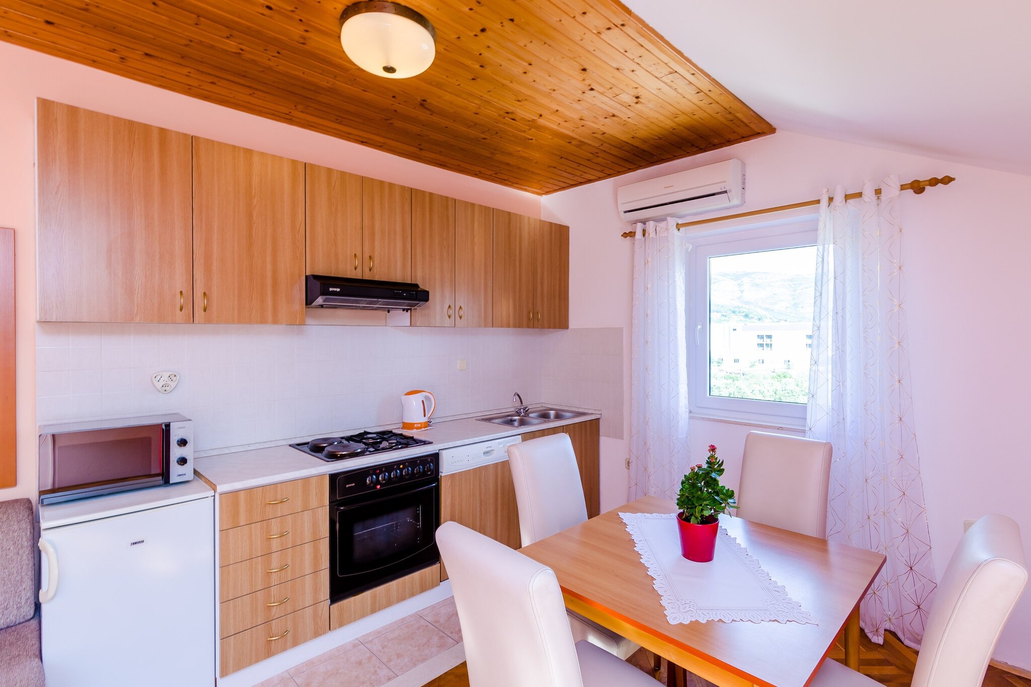 Apartments Mali Paradiso are situated in Mlini, a lovely village near historic Dubrovnik. Common swimming pool with outdoor shower and toilet are at guests disposal. All guests  can also use shared children's playground with  trampoline, swings and deckchairs as well as barbecue facilities and outdoor kitchen dining area.
Laundry washing is free of charge.
Luggage storage before check in and after check out are available, so that you can explore the area a bit more before departure.
Free private parking is possible on site.

This lovely studio apartment is a perfect fit for four persons.
It features free Wi-Fi, air condition, flat screen SAT TV. Kitchen is fully equipped  and comes with combined dining and seating area. External private bathroom comes with shower cabin. Furnished balcony with pool view is at guests disposal. Guests can enjoy their staying on furnished terrace with shared swimming pool, children's playground and BBQ facilities.
Baby cot, hair dryer and ironing facilities are available upon request.
Bathroom is separate with hall from the room.

Apartments Mali Paradiso are situated in Mlini, a lovely village near historic Dubrovnik. Mlini is a small, idyllic fishing settlement located halfway between Dubrovnik and Cavtat with intact beauty, rich vegetation and stunning beaches as well as historical and cultural heritage.
The closest beach is only 400 meters away. Also, down at the beachfront there are many bars and restaurants. Shopping center with worldwide brands and a big supermarket is also 400 meters away. Nearest bus stop is just down the street.

Distance to Dubrovnik airport in Ä†ilipi is 11.7 km.