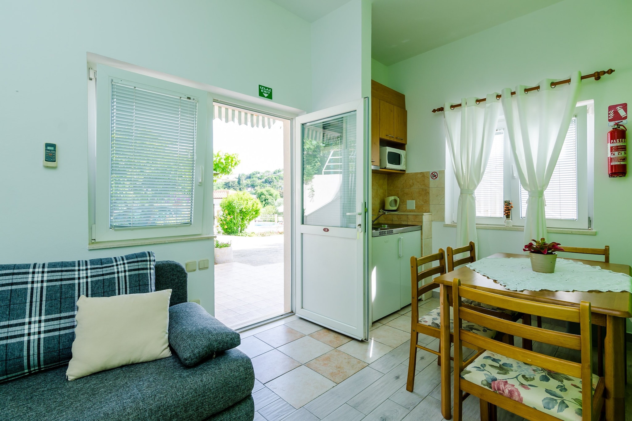 Apartments Mali Paradiso are situated in Mlini, a lovely village near historic Dubrovnik. Common swimming pool with outdoor shower and toilet are at guests disposal. All guests  can also use shared children's playground with  trampoline, swings and deckchairs as well as barbecue facilities and outdoor kitchen dining area.
Laundry washing is free of charge.
Luggage storage before check in and after check out are available, so that you can explore the area a bit more before departure.
Free private parking is possible on site.

This lovely one bedroom apartment is a perfect fit for four persons.
It features free Wi-Fi, air condition, flat screen SAT TV. Kitchen is fully equipped  and comes with dining area. Living room includes convertible sofa. Private bathroom comes with shower cabin. Furnished terrace with pool view is at guests disposal. Guests can enjoy their staying on furnished terrace with shared swimming pool, children's playground and BBQ facilities.
Baby cot, hair dryer and ironing facilities are available upon request.

Apartments Mali Paradiso are situated in Mlini, a lovely village near historic Dubrovnik. Mlini is a small, idyllic fishing settlement located halfway between Dubrovnik and Cavtat with intact beauty, rich vegetation and stunning beaches as well as historical and cultural heritage.
The closest beach is only 400 meters away. Also, down at the beachfront there are many bars and restaurants. Shopping center with worldwide brands and a big supermarket is also 400 meters away. Nearest bus stop is just down the street.

Distance to Dubrovnik airport in Ä†ilipi is 11.7 km.