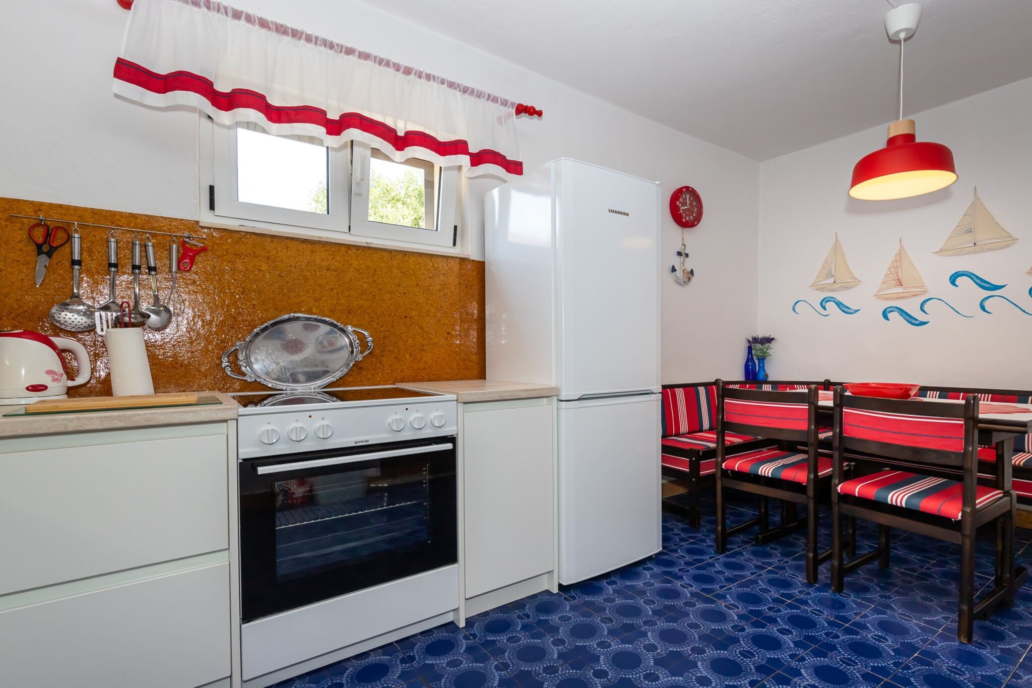 On the 1st floor: (Living room(TV, seating area), Kitchen(dining table, stove, electric kettle, toaster, espresso machine, oven, microwave, dishwasher, fridge, freezer), bedroom(small double bed), bedroom(small double bed), bedroom(single bed), bathroom(shower), toilet)\n\nguest toilet, cot, washing machine, air conditioning, terrace, BBQ, parking, ironing board, iron, hairdryer