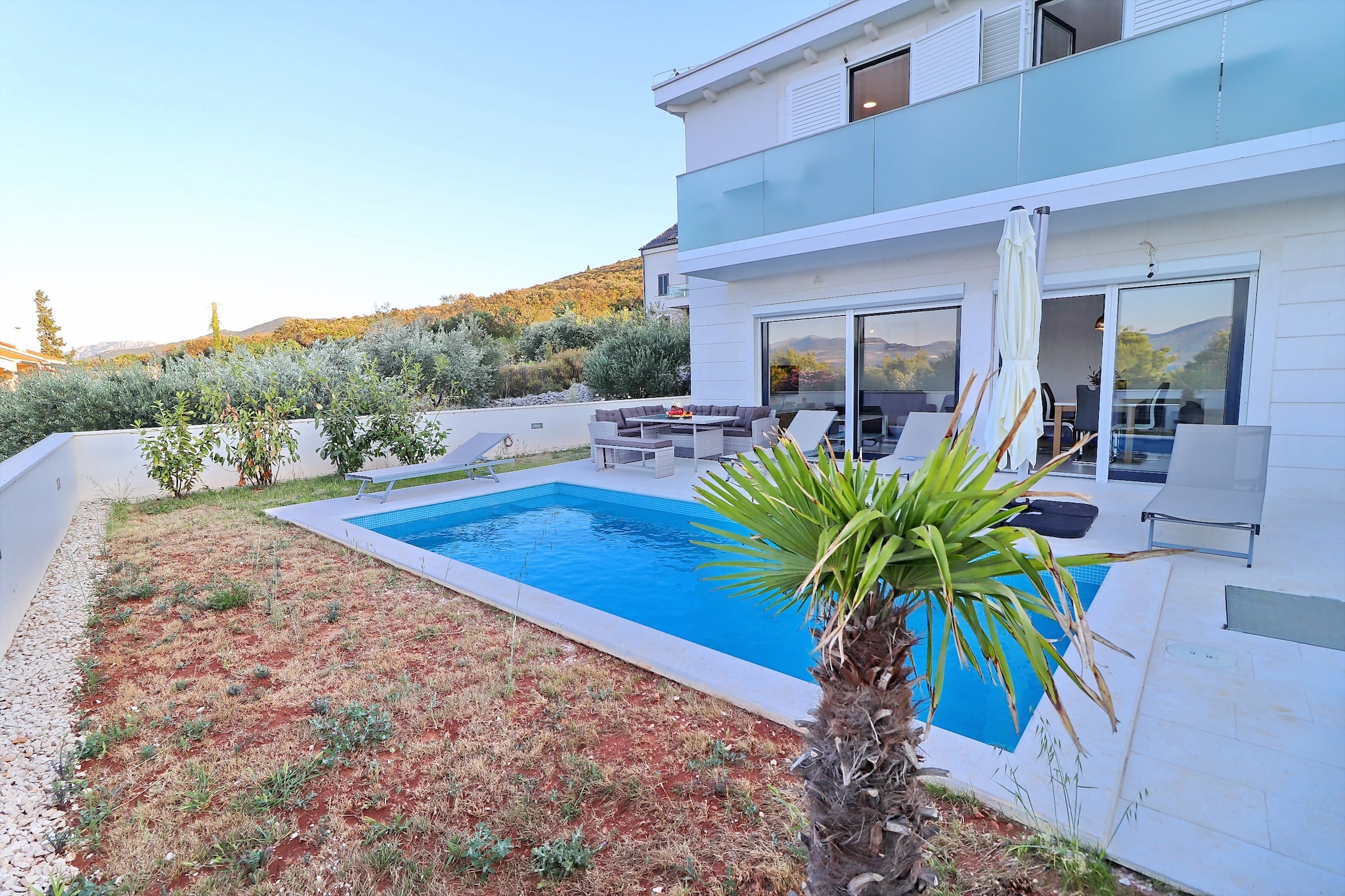 Villa Dalmatinka is situated in Drače, a little coastal village on Pelješac peninsula near famous Ston with beautiful beaches and historic monuments, cafes and world class restaurants. The property offers you a spacious four bedroom villa with private outdoor swimming pool and large furnished sun terrace fitted with sunbeds and parasols.

Note:

Private parking is available, reservation is not required.
Baggage drop-off is available before check-in.
Wi-Fi is available throughout the property.
Pets are not allowed.
Baby cot is available on request.

This lovely four bedroom villa with private pool is perfectly fit for up to eight people. Additionally, one child up to 12 years old can stay for free. Villa features free WiFi, air conditioning and SAT flat screen TV. The open space living room comes with sofa and sitting area and it's combined with the equipped kitchen and dining area. The villa has three private bathrooms with shower and toilet. Washing machine, hair dryer and baby cot are provided.

This location is perfect for guests who love to enjoy the sun and the sea, being close to the touristic centers but far enough to avoid the crowds and keep their peace and privacy.  Beautiful pebble beach is within 100 m. Various restaurants and bars can be found in the vicinity. Nearest bus stop is in 2 km range of the property
KafićEdivo - Winery & Wine Bar 300m
Beach Luka Drače 80 m

Nearest  ferry port is 30 km away while Dubrovnik Airport 100 km away.