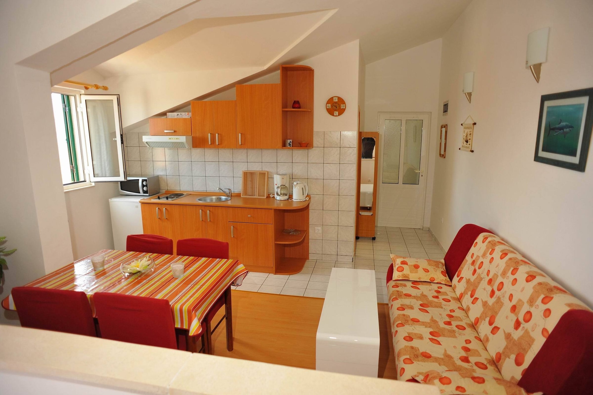 Villa Anni features five self-catering accommodation units in Sutivan, known for its hospitality, its numerous pebble beaches offering peace and quietness, the scents of Mediterranean and its crystal clear sea. Common sun terrace fitted with sunbeds and parasols, outdoor seasonal swimming pool, BBQ facilities and outdoor dining area are at your disposal, just perfect for a nice and relaxing family or friends vacation.
Please note, the use of the swimming pool is limited to a specific time of the day, and has it's rules. The swimming pool is open each day from: 8 - 13 and 16 - 19 H.
Luggage storage is possible prior check in and after check out, so you can explore the island a little more before your departure.
Free private parking is provided, reservation is not required.
This lovely studio with furnished balcony is perfectly fit for up to two people.
It features free WiFi, air conditioning, SAT LCD TV as well as a equipped kitchen with dining area. The apartment has a private bathroom with shower, toilet, bidet and hair dryer.
Villa Anni is located in Sutivan, little idyllic town on the island of Brač, known for its beautiful beaches and surrounding forests, Mediterranean atmosphere, vineyards and olive plantations. The place is very quiet and ideal for a relaxing holiday with a landscape of beautiful nature and crystal clear sea and beaches.
Closest grocery store and a restaurant can be found within 300 m distance.
Ferry port in Supetar, with regular connections to Split, is approximately 7 km away, while Brač Airport is 26 km away.