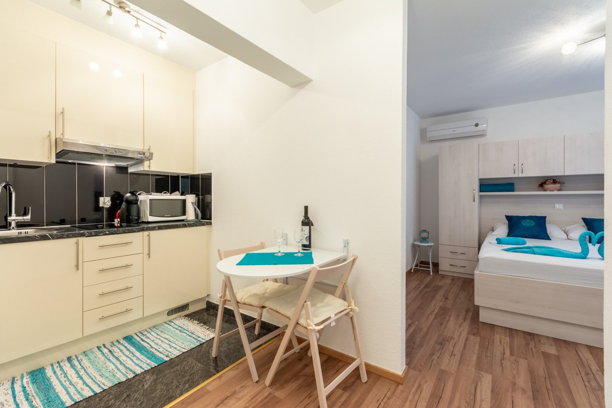 Apartments Palma offer self-catering accommodation units  located in quite little place Stanici, near Omiš.

Common furnished terrace as well as BBQ facilities are at your disposal.

Free parking is provided, reservation is not required. 

Luggage storage is possible prior check in and after check out, so you can explore the city a little more before departure.

From the main road to the accommodation there is a little hill (approx. 100 m ).

This lovely studio with furnished balcony is perfectly fit for up to three people. It features free WiFi, air conditioning and SAT LCD TV, as well as a equipped kitchenette and dining table. The  apartment has a private bathroom with shower and toilet.

Baby cot and hair dryer are at your disposal.

Apartments Palma are  only 5.8 kilometers away from Omiš, town and port in Dalmatia region of Croatia.  Grocery store, restaurants, bar and bus station are within 100 m range, while the nearest beach is only 500 m from the accommodation.

Whatever direction you drive in from Omiš, it’s just a matter of minutes when you’ll be reaching a famous tourist destination. Less than 25 kilometers north-west of Omiš lies Split, with its more than 1700 years old Emperor Diocletian’s Palace, and just  20 minutes further in the same direction you’ll find  the town of Trogir, a living museum of sorts and one of the few towns in the world with its entire historic city inscribed on the UNESCO’s World Heritage List.
Driving further along the coast, you’ll reach two other popular holiday destinations, the cities of Šibenik and Zadar, and in the hinterland of Šibenik you can visit one of the top one-day tour destinations in Dalmatia, the National park Krka, which is no more than a two-hour drive away from Omiš along the A1 motorway!

Split Airport is 46 km away from the property.