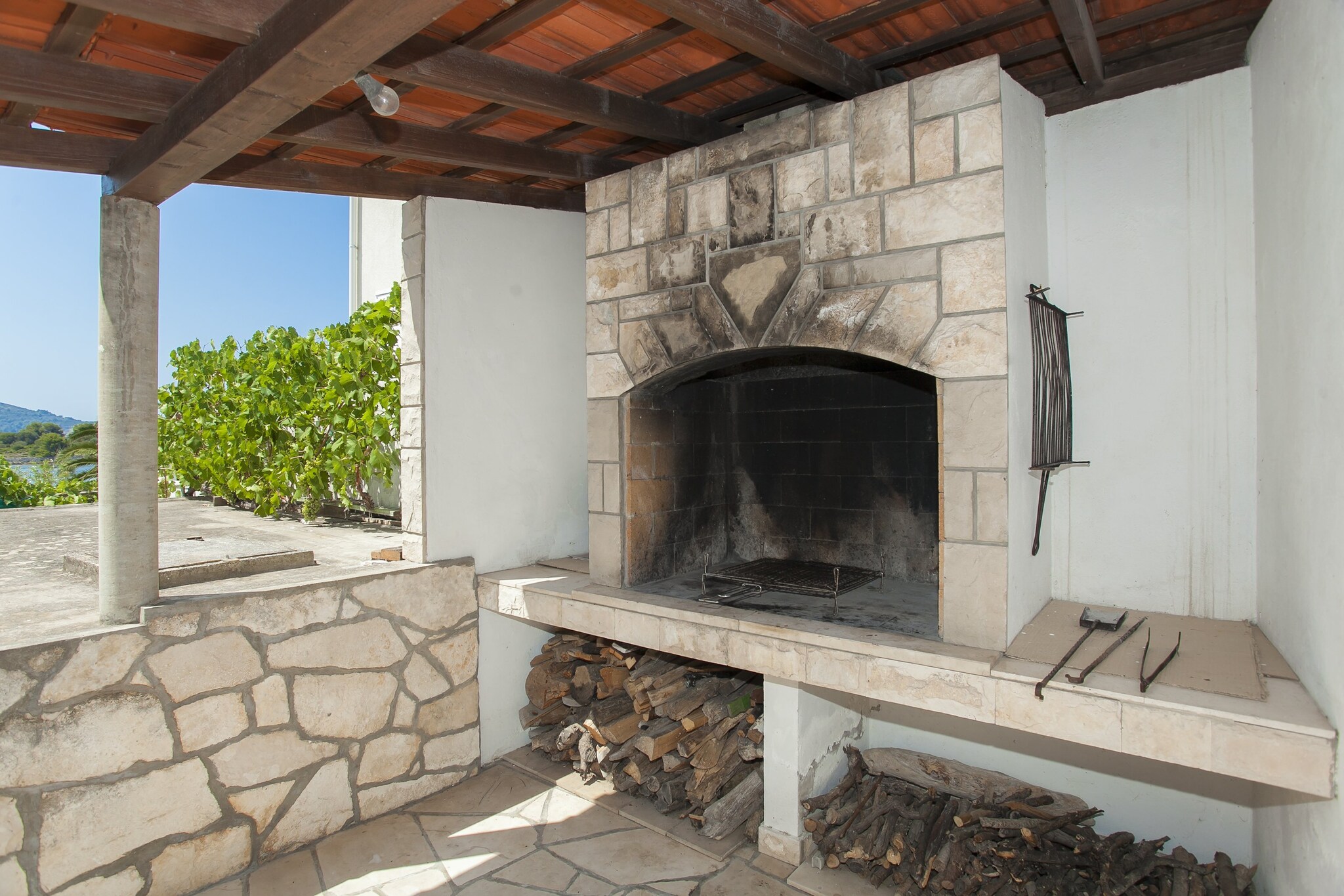 Holiday Home Neda is self catering accommodation located in Vela Luka at Island of KorÄula.

Situated only a stone throw away form the nearest beach, Holiday Home Nada offers a spacious furnished terrace as well as BBQ facilities, which is just perfect for a nice and relaxing family or friends vacation.

Luggage storage is possible prior check in and after check out. 

Private parking is provided.

This lovely three bedroom holiday home is perfectly fit for up to 6 people. Living room comes with seating area and flat screen SAT TV. Kitchen comes with oven, stove, refrigerator, freezer, coffee maker and dining area. Property features private bathroom with shower.

Property features air conditioning and free WiFi.

Vela Luka is lovely little port town on the western shore of the island of KorÄula, known for its beautiful beaches and caves. In the surroundings of the apartment, guests can find everything they need for every day life during their vacation. The nearest market, supermarket and pharmacy can be found in 5 km range from the property. The nearest restaurant is 500 m away from the property.

The nearest bus station is 5 km away from the property.