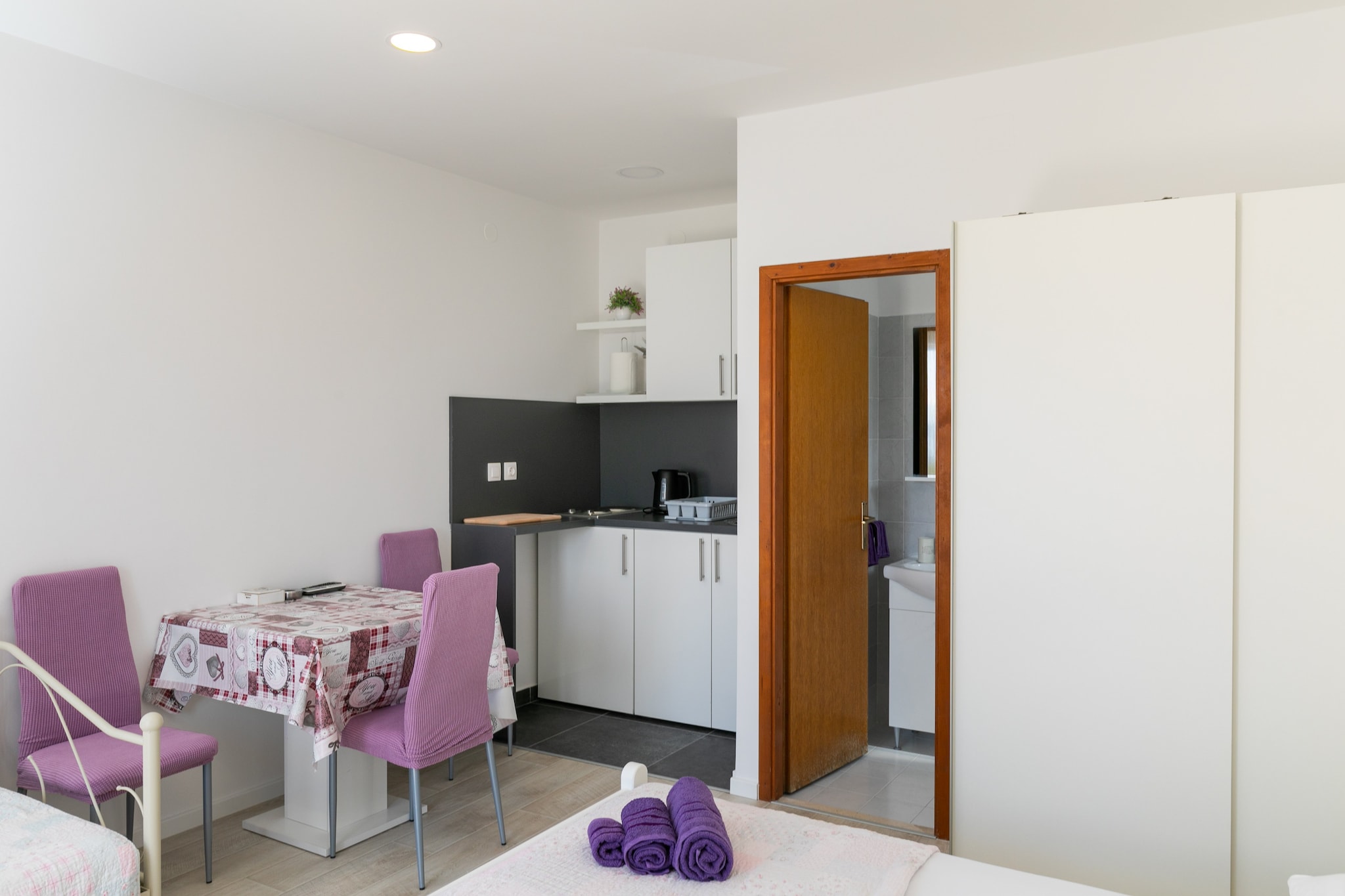 Apartments Karol & Mara are located in Mlini, a lovely village near historic Dubrovnik. Mlini is a small, idyllic fishing settlement located halfway between Dubrovnik and Cavtat with intact beauty, rich vegetation and stunning beaches as well as historic and cultural heritage.

Common spacious sun terrace fitted with sunbeds and parasols, outdoor furniture and dining area are at your disposal, which is just perfect for a nice and relaxing family or friends vacation.

Luggage storage is possible prior check in and after check out, so you can explore the city a little more before your departure. 

Free private parking is provided, reservation is not required.

This lovely studio with furnished balcony is perfectly fit for up to three people. It features free WiFi, air conditioning, SAT/cable LCD TV,  as well as a equipped kitchenette and private bathroom. 

Hair dryer and baby cot are provided.

The nearest beach is only 200 m away. Various restaurants, bars and shops can be found on the famous seaside promenade. Cavtat is 5 km away while the Old Town of Dubrovnik is only a 20 minutes ride away.

The nearest bus stop is 50 m away. Dubrovnik Airport is 11 km away, while Dubrovnik Main Bus Station and Ferry Port, connecting the mainland with various  islands are 12 km away.