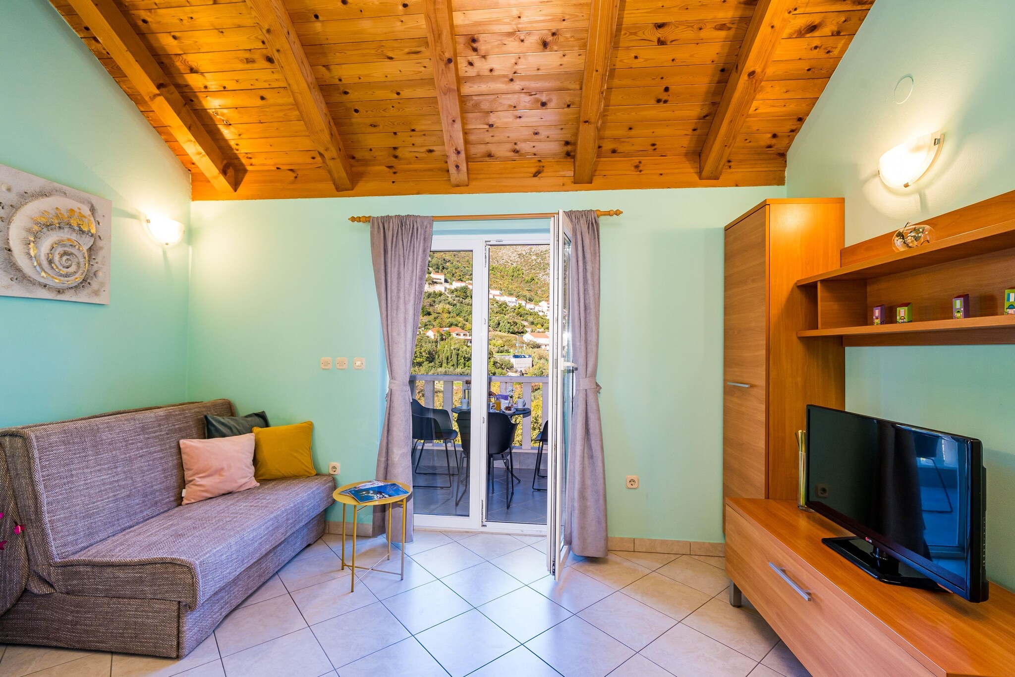 Apartments Vodnica are situated in a picturesque coastal village Zaton, only 20 min drive away from  the historic Old City of Dubrovnik.

Common BBQ facilities, outdoor furniture and dining area as well as a shared garden are at your disposal, which makes this place ideal for a nice and relaxing family or friends vacation. 

Luggage storage is possible prior check in and after check out, so you can explore the place a little more before your departure. 

Free private parking is provided, reservation is not required.

This lovely one bedroom apartment with furnished balcony is perfectly fit for up to four people. It features free WiFi, air conditioning and cable/SAT LCD TV. The open space living room comes with sofa and sitting area, and it's combined with the equipped kitchen and dining area. The apartment has a private bathroom.

Iron and ironing board, hair dryer and baby cot are at your disposal.

This location is perfect for guests who love to enjoy the sun and the sea, being close to the touristic center, but far enough to avoid the crowds and keep their peace and privacy.

This apartment is located only couple of minutes walk from the nearest beach. Various restaurants and bars can be found on the beach. Grocery store can be reached within 150 m range.
.

The bus stop is located 500 m away. Dubrovnik  Main Bus Station and Ferry Port, connecting the mainland with various Dalmatian islands, are 13 km away, while Dubrovnik Airport is 33 km away from the property.