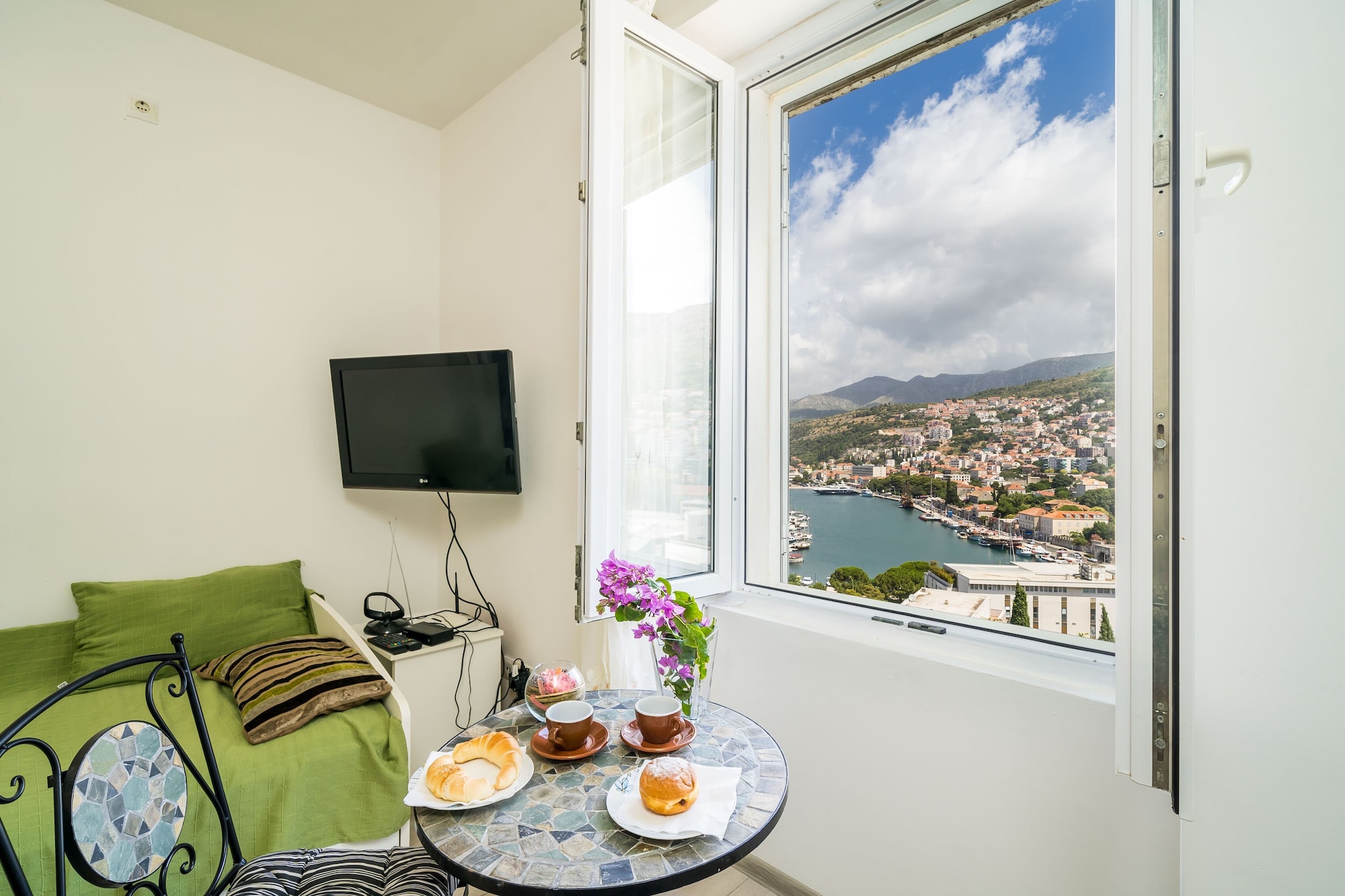 Apartment Luka is self catering accommodation located in Dubrovnik, 2 km away from Dubrovnik Old Town.
Public parking is possible at the location nearby but the reservation is not possible.
This lovely two bedroom apartment is situated on the first floor and has private entrance. Apartment features seating area with cable flat screen TV. Air conditioning and free WiFi are provided. Kitchen comes with oven, stove, refrigerator, kettle, dishwasher, toaster and dining area. Private bathroom features walk in shower, hair dryer and free toiletries. Washing machine and ironing facilities are provided.
Apartment Luka is located 2 km away from Dubrovnik Old Town. This part of the town is very popular, because everything you may need is near the accommodation. The nearest beach is located 2 km away from the property. Restaurant and coffee bar are located 500 m away, while market can be found at 300 m range.
The nearest bus station is located 300 m away. Dubrovnik Airport is 28 km away from the property.