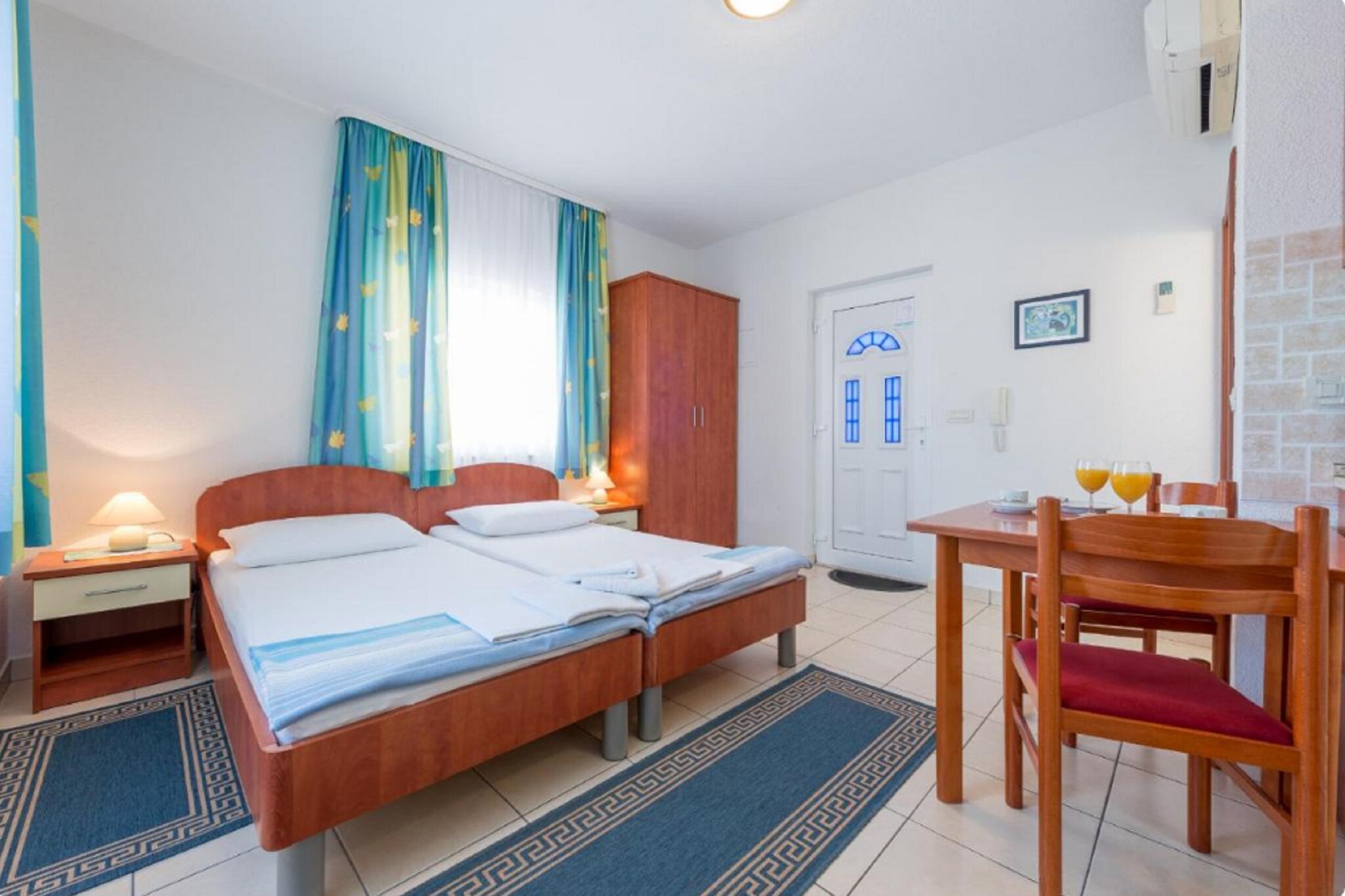 Ground floor: (Living room, Kitchen, Living/bed room(single bed), bathroom)\n\ndining room, toilet, TV, dining table, stove, electric kettle, microwave, fridge, cot, shower, air conditioning, terrace, sun loungers, parking, swimming pool, iron, hairdryer