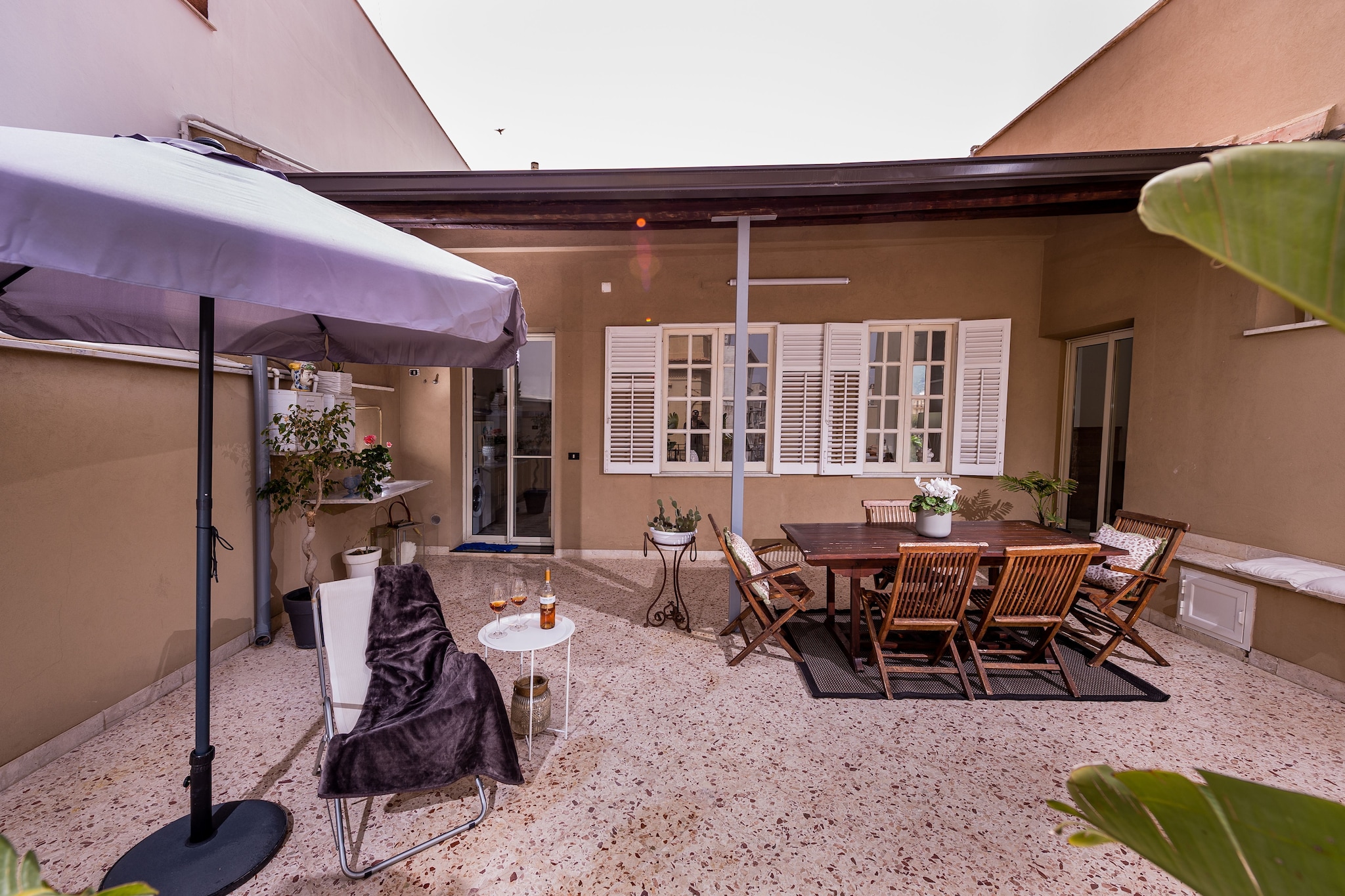 This house is a lovely historical apartment in the heart of Terrasini, a wonderful sea village best known for its unbelievable sunsets. 

This lovely white and blue home, the typical mediterranean architecture colours, is located inside a noble building which has an independent entrance and consists of a large living room with a conversation area, two bedrooms, one double and one twin, both with ensuite bathrooms. Kitchen is set in a large open with a dining area and a conversation corner. The fireplace
enriches the environment warm and cozy at the same time. The furniture is well-kept and the design features make the rooms elegant and refined. 

The house is embellished by two beautiful terraces, diametrically opposite views that allow the guests to enjoy the green countryside and the citrus groves of the garden below, while on the other side the apartment overlooks the old town and the magnificent blue sea views. These outdoor areas are furnished to allow guests a comfortable outdoor stay and ensure moments of healthy relaxation.

The kitchen is set in a spacious open area with a dining section and a cozy conversation corner, enriched by a fireplace that adds warmth and comfort. The furnishings are well-kept, and the design features make the rooms elegant and refined. Casa dei Mori is embellished with two beautiful terraces, offering diametrically opposite views that allow guests to enjoy the lush countryside and the citrus groves below, while the other side overlooks the old town and the magnificent blue sea. These outdoor areas are furnished to provide a comfortable outdoor stay, ensuring moments of relaxation.

Note: 100kwh electricity consumption is free per stay and post that 0.5euros per kwh will be charged.