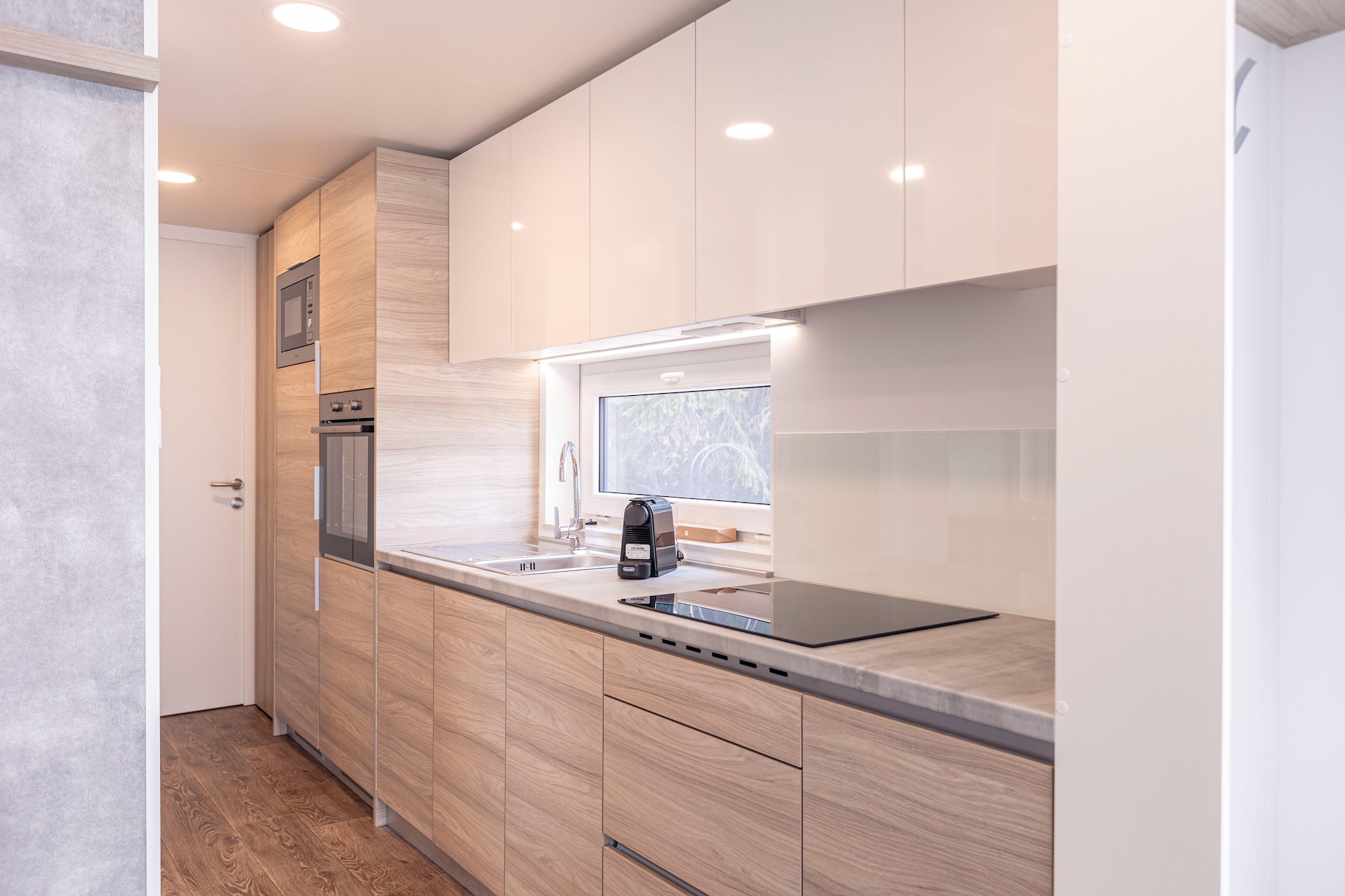 Ground floor: (hallway, Living room(double sofa bed, TV), open kitchen(electric kettle, toaster, coffee machine, oven, microwave, dishwasher, fridge-freezer), bedroom(double bed), bedroom(single bed, single bed), bathroom(shower, washbasin, toilet))\n\ngarden doors, air conditioning, terrace, garden furniture