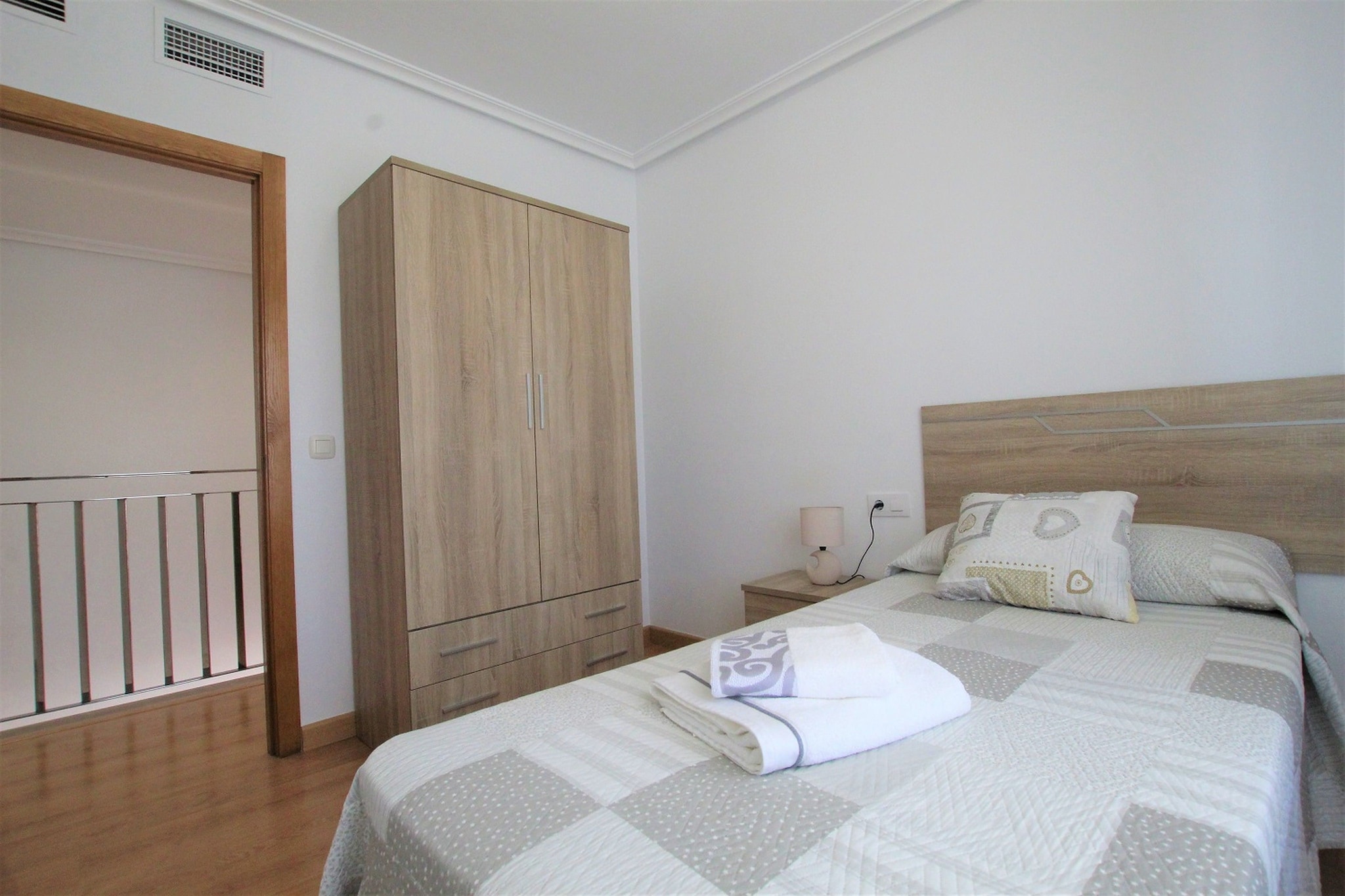 Ground floor: (open kitchen(dining table, cooker, coffee machine, oven, microwave, dishwasher, fridge-freezer, ironing board, iron), Living/diningroom(TV, seating area, air conditioning), bathroom(washbasin, toilet), washing room(shower, washing machine), terrace)\n\nOn the 1st floor: (bedroom(double bed, balcony), bedroom(single bed, single bed), bedroom(single bed), bathroom(shower, washbasin, toilet))\n\ngarden furniture, BBQ