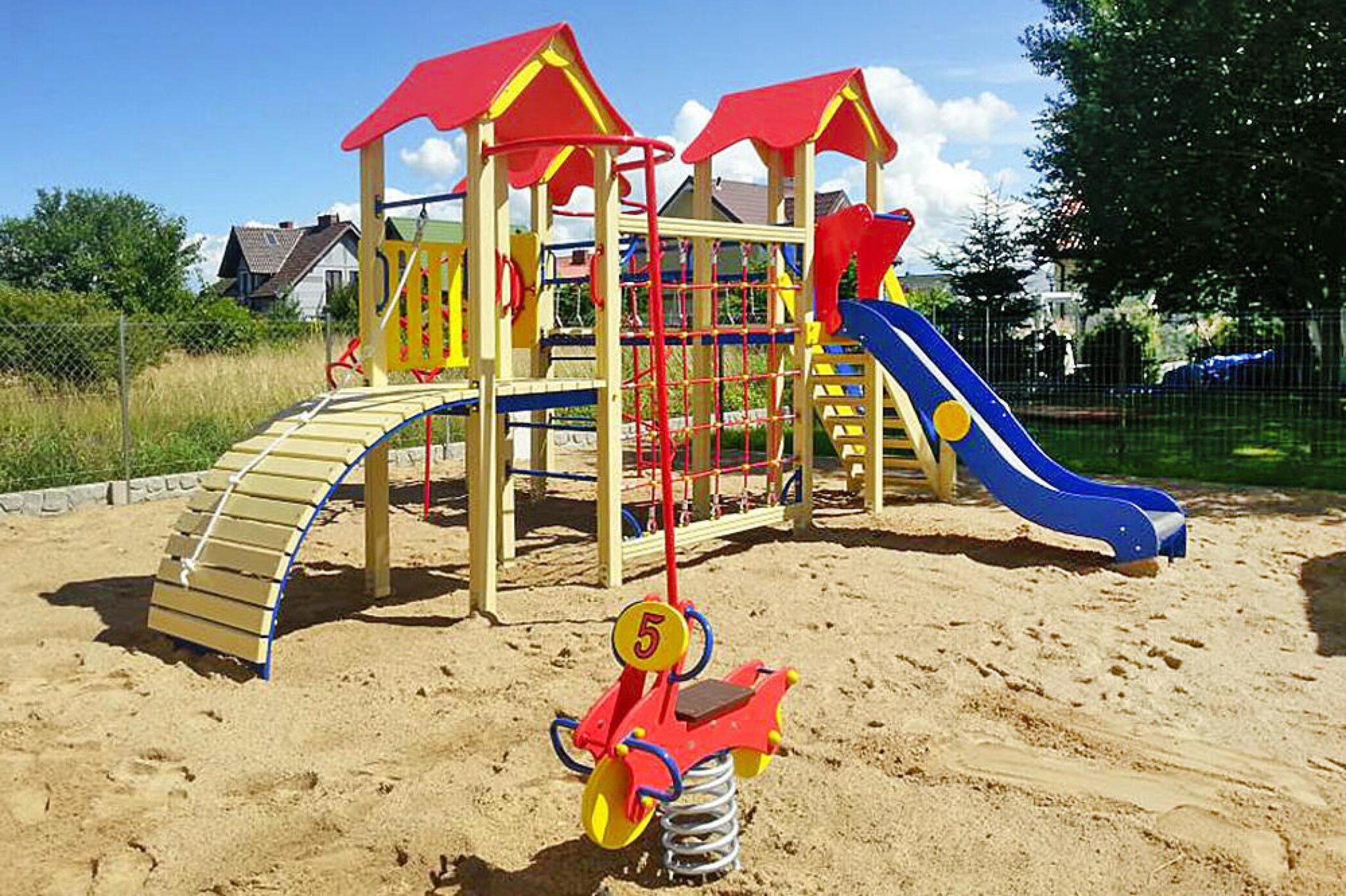 open kitchen(hob(2 ring stoves, induction), electric kettle, fridge), Living/bed room(single bed, single bed, double sofa bed, TV(flatscreen, digital)), bathroom(shower, washbasin, toilet), Reception, Internet access, Table tennis, Indoor playroom, Play area, Lawn, TV(flatscreen), washing machine(shared with other guests, paid), balcony, heating(electric, through air conditioning), air conditioning, garden(shared with other guests, fenced, 800 m2), garden furniture, BBQ(charcoal), parking, sand pit(shared with other guests), slide(shared with other guests), table football(shared with other guests), fitness equipment(shared with other guests), Swing set