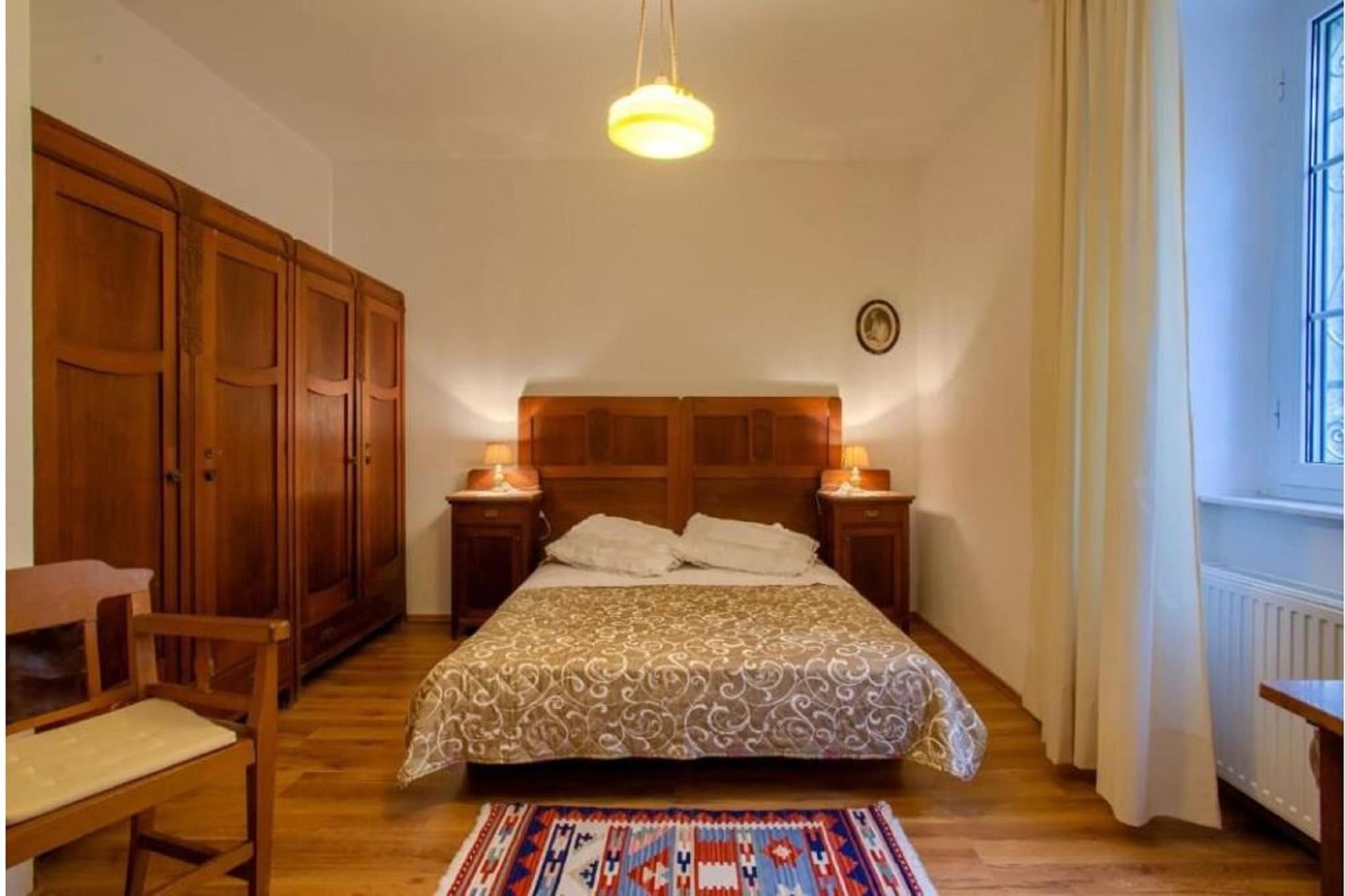 Ground floor: (open kitchen(hob, dishwasher, fridge-freezer, washbasin), Living/diningroom(double sofa bed, TV, dining table), bedroom(double bed), bedroom(double bed or 2 single beds), bathroom(shower, washbasin, toilet, bidet, hairdryer), air conditioning)\n\nshower(outside), terrace, garden, garden furniture, BBQ, parking