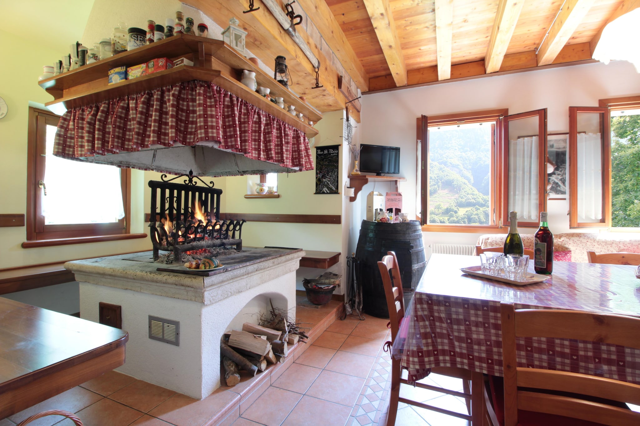 Set against the serene backdrop of Cison di Valmarino, this delightful holiday home offers the perfect blend of comfort and nature. Surrounded by lush greenery and majestic mountain views, the home boasts a spacious garden complete with sun loungers, a hammock, and play equipment for children. Whether you're firing up the BBQ on the patio or sipping morning coffee while the little ones enjoy the swing set, the atmosphere is calm and welcoming, ideal for families seeking peace, play, and outdoor fun. From your doorstep, scenic trails wind through the forest, leading to natural wonders like the breathtaking Brent de l'Art canyon just 5 km away. Lake Santa Croce, only 30 km from the property, is perfect for windsurfing, kitesurfing, and kayaking, while the Serva and Dolada mountains invite you to soar via hang glider or paraglider. For a more relaxed pace, enjoy a day at the lake beach in Revine Lago or take a scenic drive to the coast of Caorle, 90 km away. Golfers can tee off at Golf Club Cansiglio, and charming Treviso is just 50 km from your retreat.