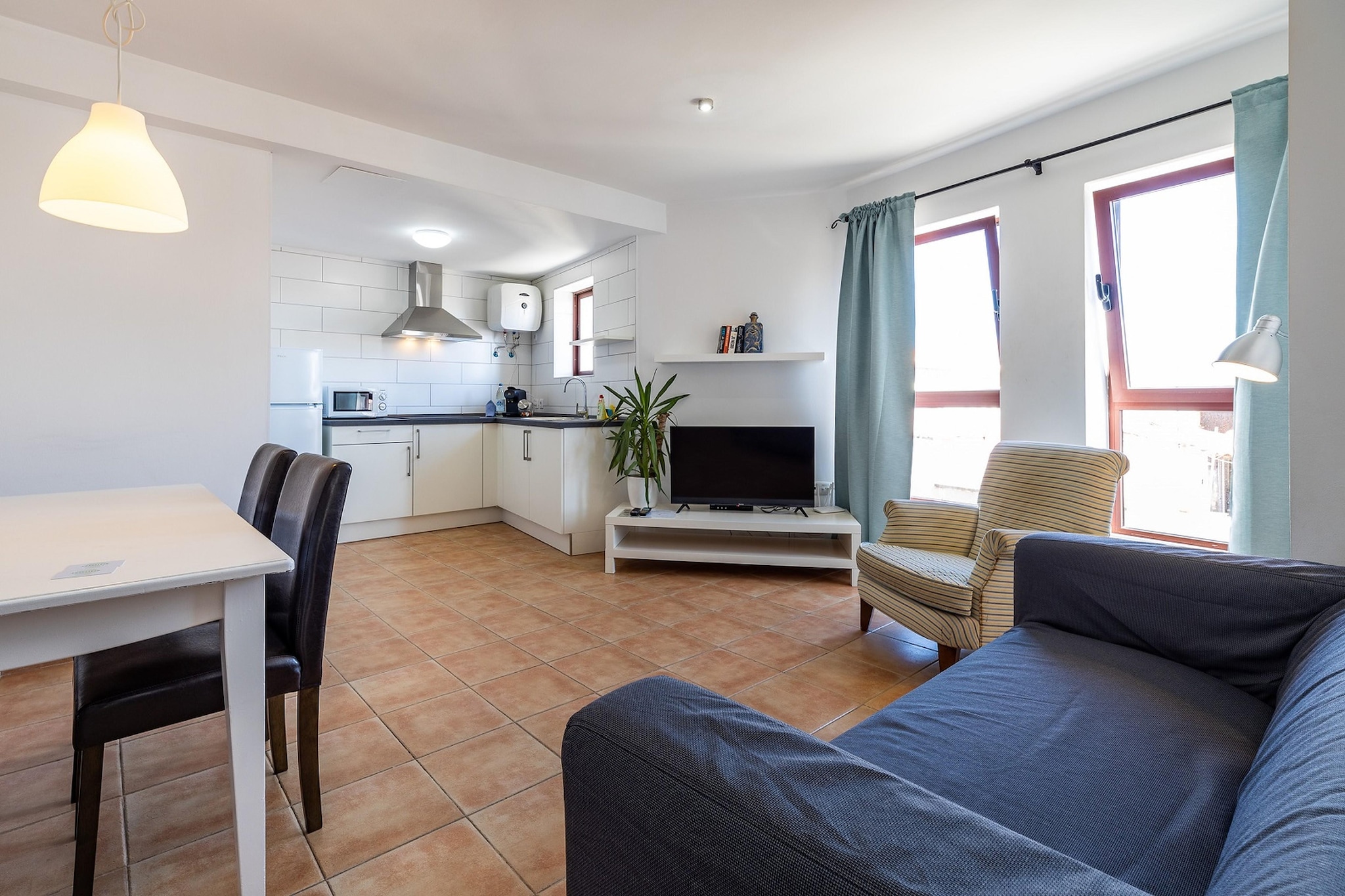 This comfortable apartment is ideally located, approximately 100 meters from Corralejo beach. It is perfect for a romantic holiday with the love of your life, without children!

This pleasant accommodation is located in La Oliva, on the Canary Island of Fuerteventura. You can laze on the nearby beach or visit nice sights on the island, such as the Oasis Wildlife Fuerteventura and Isla de Lobos.

The apartment has a comfortable living room and a bathroom that is equipped with all conveniences. Prepare culinary delights for your loved one in the well -equipped kitchen and enjoy it together at the dining table in the living room. You also have access to a shared terrace and free WiFi.

This accommodation is only for adults. Reservations are not allowed for children under the age of 18.

About Belvilla

When you stay in a Belvilla home, you can rest assured of a unique holiday home in ideal surroundings at an attractive price. The portfolio of accommodations consists of more than 40,000-holiday homes in 20 European countries. Interested in a weekend getaway, a summer or winter sports holiday or simply a short break? Do you prefer the coast, the countryside or the mountains? Whatever your preference, there is a Belvilla home to meet your needs, from a cosy gîte for two to a castle big enough for the entire family, from an apartment in the heart of Rome to a cabin in the middle of nowhere, from a simple tree house to a luxury dream villa and from close to home to the other side of Europe.

A Belvilla home gives you the freedom to enjoy breakfast in your pyjamas or continue a good conversation into the morning hours without having to worry about the bar's closing time. Prepare gourmet meals with fresh local ingredients in your own kitchen and take advantage of having your own swimming pool to do as many cannonballs as you want! In other words, you can enjoy complete privacy in your home away from home.