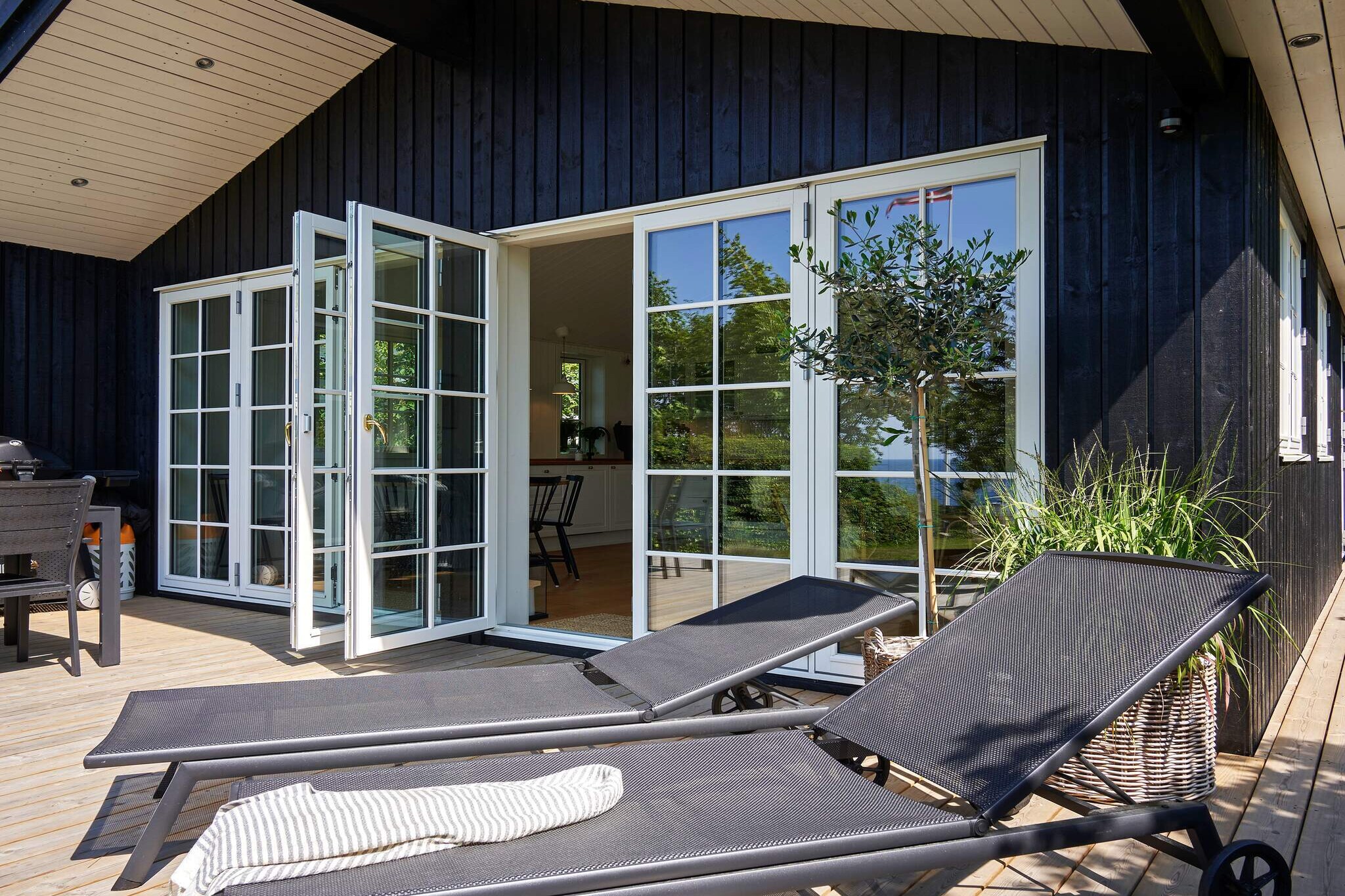 Kitchen(cooker(electric), dishwasher, fridge-freezer), Living/bed room, bedroom(double bed), bedroom(double bed), bedroom(2x single bed), bathroom(floor heating)(washbasin, shower, toilet, washing machine), shower(outside), balcony or terrace, heating(electric), terrace, garden, garden furniture, air to water heatpump