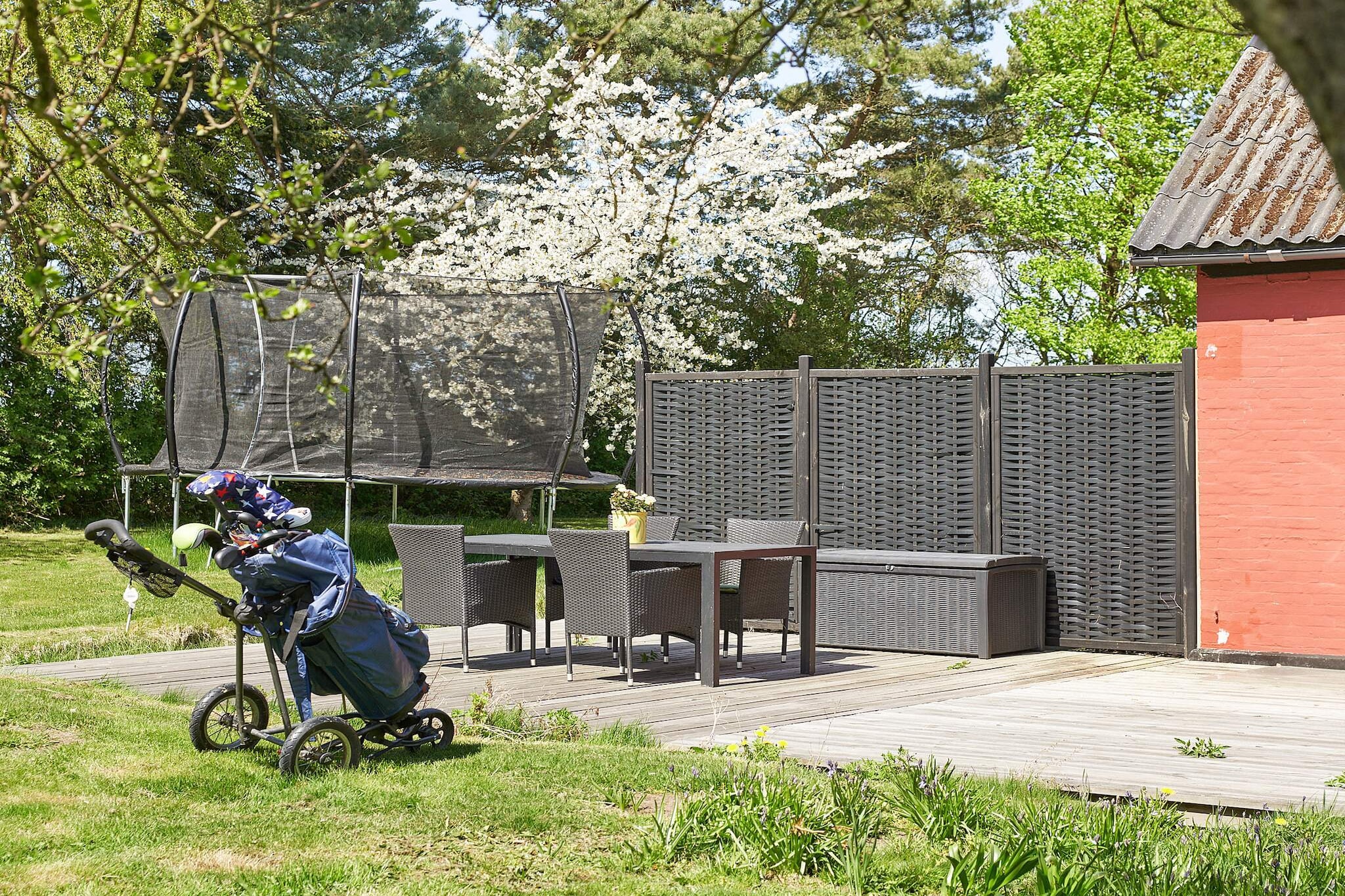 Kitchen(stove(induction), coffee machine, oven, microwave, fridge-freezer), Kitchen(stove(induction), coffee machine, oven, microwave, fridge-freezer), Living/bed room(double bed, TV), Living/bed room(TV), bedroom(2x single bed), bedroom(double bed), bedroom(4x single bed), bedroom(double bed), bathroom(washbasin, shower, toilet), bathroom(washbasin, toilet), bathroom(washbasin, shower, toilet), heating(electric), terrace, garden, play equipment, air to water heatpump