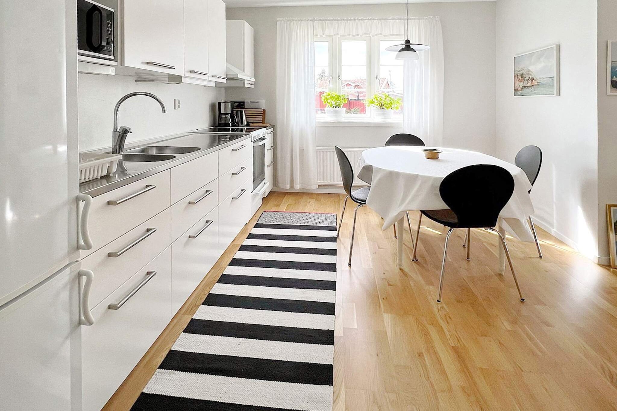 open kitchen(cooker(electric), hood, coffee machine, microwave, fridge-freezer), Living/bed room(TV), Living/bed room, bedroom(single bed, 2x bunk bed), bedroom(3x single bed), bathroom(washbasin, shower, toilet), washing machine, heating(electric), garden furniture, BBQ, parking, air to air heatpump