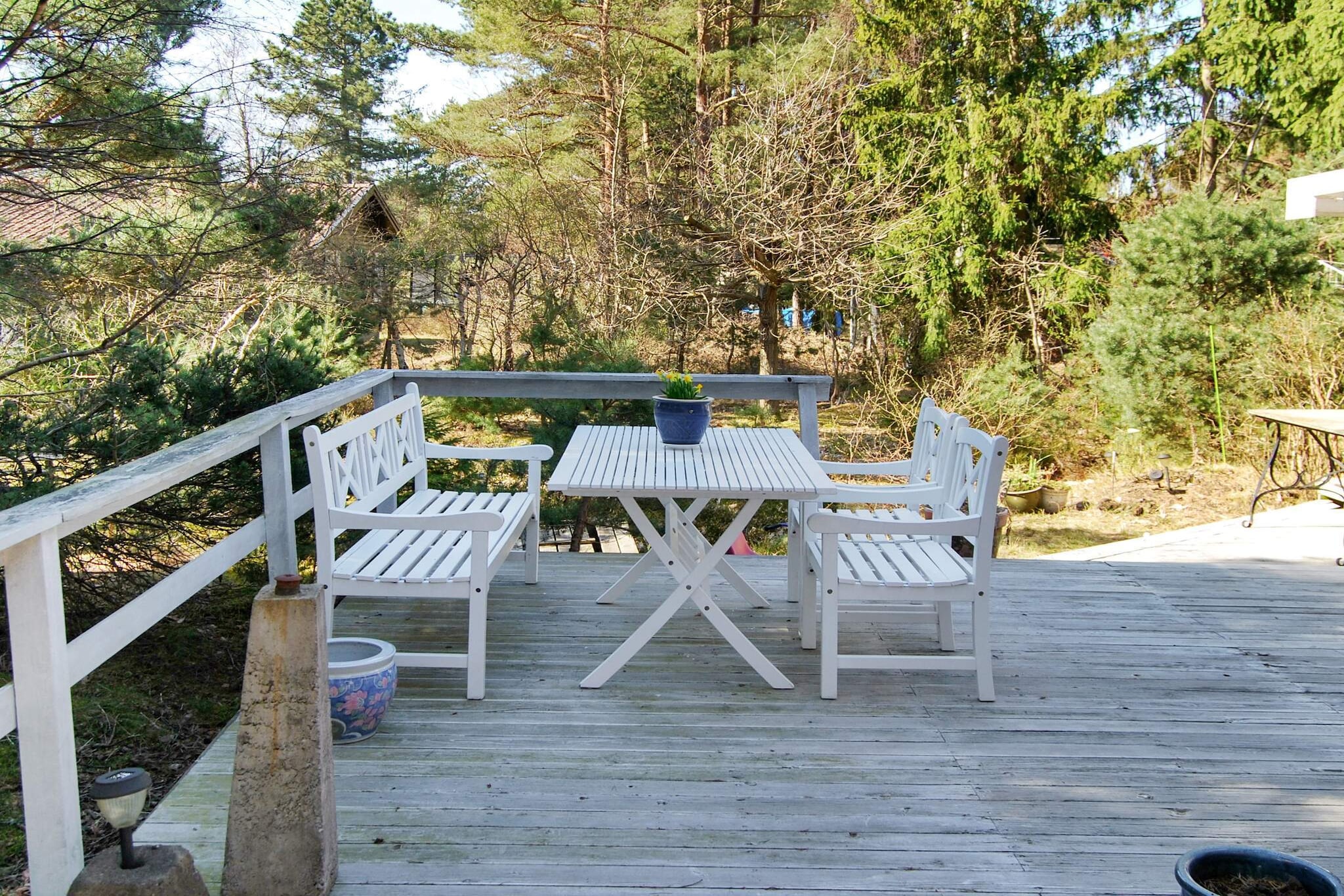 In the middle of HÃ¶llviken's lovely cottage area, this charming cottage is located on a quiet forest plot surrounded by pines and birches. Here you have only a few minutes down to the elongated sandy beach at KÃ¤mpinge and Ljungen for a nice morning bath from the pier. Here you have one of Sweden's holiday paradises within easy reach and only 10 minutes by car down to Falsterbo-SkanÃ¶r! This cozy cottage Strandwi, built in 1925, has room for an entire family with many nice common areas. In the open living room there is a sofa group, TV and a dining area adjacent to the well-equipped kitchen. From here you also go to the large lovely glazed conservatory which has both a sitting area and dining area. On the large wooden terrace there are more seating areas for sun and shade and a barbecue area with a view of the small forest plot's trees and shrubs. There are also some toys and spaces for children to play on. On the lower floor there is also a smaller bedroom with two single beds as well as the bathroom with WC, shower cubicle and washing machine. The stairs / steps up to the upper floor / sleeping loft are very narrow and steep, so small children and people with movement / balance problems must be careful. Up there are two sleeping areas with a double bed against one end of the house and two single beds against the other. The sleeping loft is open to the ridge and without partitions. From the cottage you can reach the lovely dunes at KÃ¤mpingestranden in just a few minutes by bike or a walk of ten minutes. The center of HÃ¶llviken is a few kilometers away with several grocery stores, cafes and restaurants. In Falsterbo and SkanÃ¶r there are many popular restaurants, cozy inns and stalls selling fresh fish in the summer. There are also nice walking areas in Ljunghusen, nice golf courses and bike paths. MalmÃ¶'s large selection of shopping, entertainment and shops is also just a couple of miles north, as well as the entire SkÃ¥ne south coast with all the fishing villages to Ystad for a wonderful holiday stay. Good to know  There is a small hole in the conservatory roof that can leak in when it rains. Bed linen and towels are to be brought by the guest themselves. The cottage must be cleaned before departure.