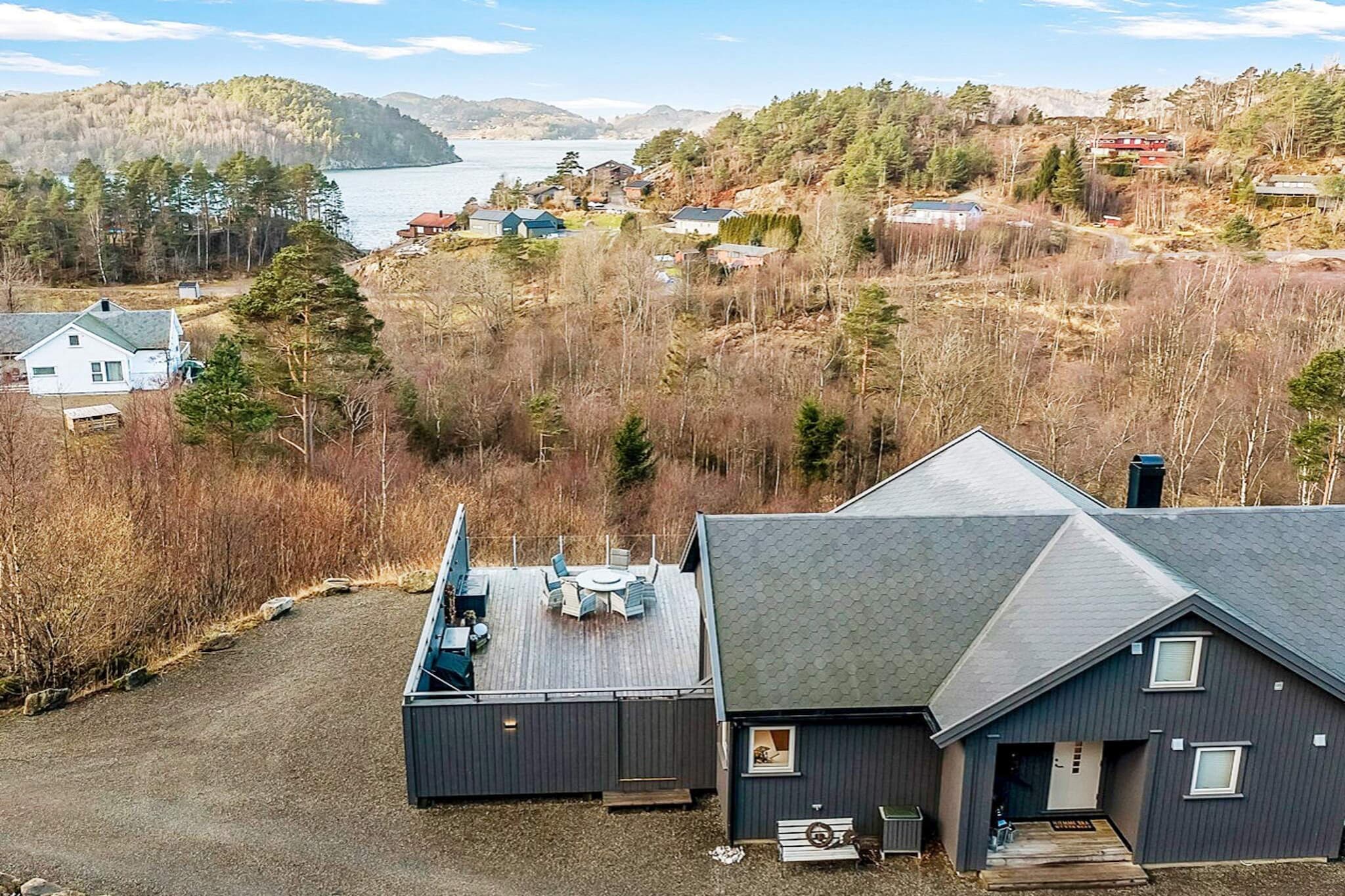 Great holidayhouse from 2016 with a view of the sea. Large terrace of approx. 100 m2. At the back of the cottage you come straight out into nature. The cottage has sleepingspace for 8 persons. 2 bedrooms downstairs, one with double bed and one with 2 bunk beds. 2 bedrooms on the 2nd floor, both with double bed. There is also a cot (3-12 years old).  On the 2nd floor there is a loft with a nice view of the cottage area. Well equipped kitchen in open solution. The holiday home has a dishwasher, washing machine and dryer. A bathroom with shower and toilet on the 1st floor, as well as extra toilet on the 2nd floor. Underfloor heating in both. The cottage has heating with a heat pump, and there is a wood stove in the living room. Free wireless internet (the code is in its own writing). TV with German channels. The large terrace is fenced and great for the little ones to play on. Here is also a good selection of garden furniture and a large gas grill. On the terrace there is also a a wood-fired hot tub.  Before you end your holiday stay, we want you to buy firewood and possibly gas for the grill, if you have used this. Parking for several cars on the property. Great swimming area with sandy beach at Rosfjord camping. There are a wealth of activities and places to visit nearby, e.g. Lyngdal ca. 13 km away, a cozy little town with shopping streets, restaurants, library and cinema. Norway's southernmost underwater restaurant in Spangereid 17 km, where you will also find the Spangereid Canal. Zoo for the little ones in Mandal (45 km) and 98 km to the famous zoo in Kristiansand. There are also many nice hiking areas in the local area around the cottage. Boat available 1.5 - 1.10. and only on request, as it is shared by other houses.