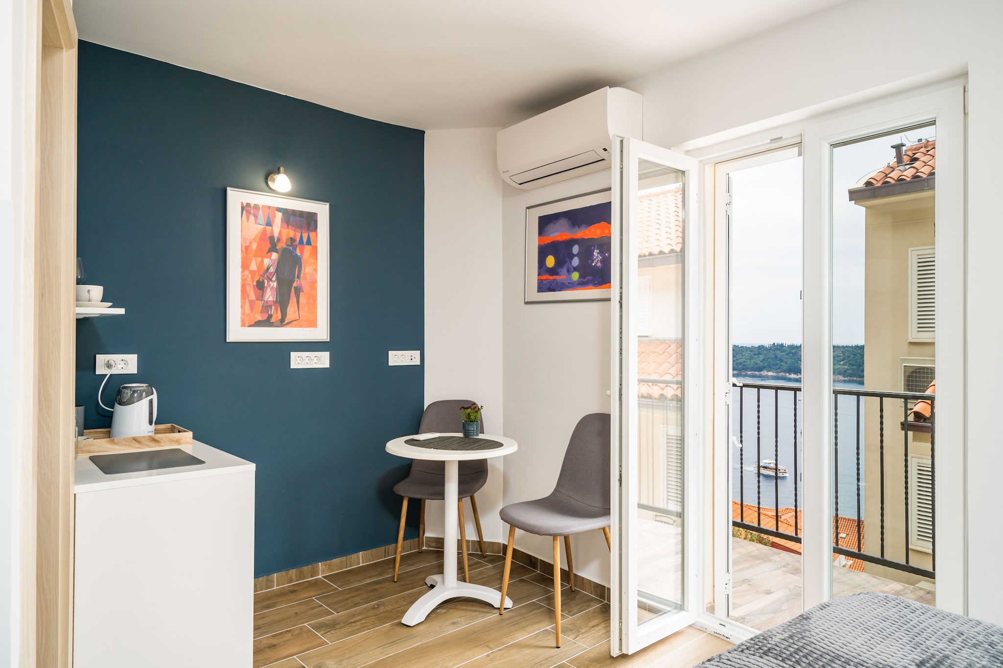 On the 1st floor: (Kitchenette(fridge-freezer), Living/bed room, bedroom(small double bed), bathroom(toilet, shower))\n\nTV, electric kettle, balcony, air conditioning, hairdryer