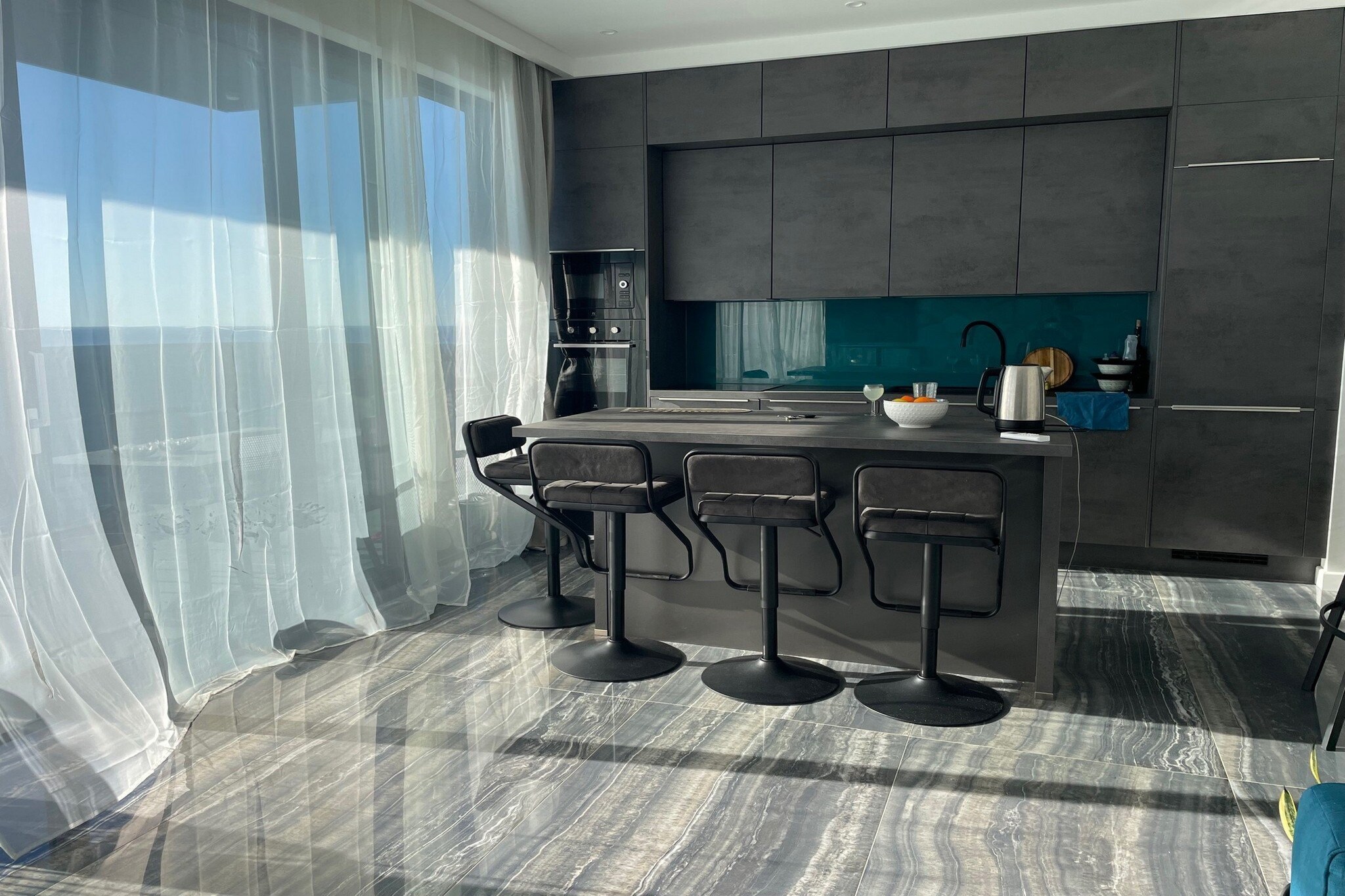 On the 2nd floor: (Living room(TV, dining table, seating area), Kitchen(stove, electric kettle, toaster, hood, oven, microwave, dishwasher, fridge, freezer), Bedroom with bathroom(double king size bed), Bedroom with bathroom(single sofa bed, double bed), bathroom, bathroom, bathroom(toilet, shower, washing machine))\n\ndining room, garage, cot, air conditioning, terrace, parking, lift, ironing board, iron, hairdryer