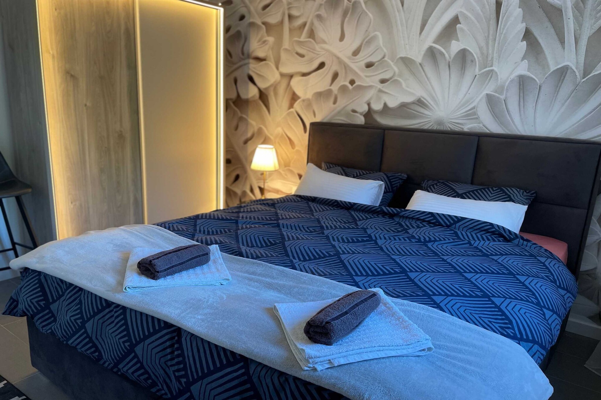 On the 2nd floor: (Living room(TV, dining table, seating area, electric kettle), Kitchen(stove, hood, oven, microwave, dishwasher, fridge, freezer, washing machine), Bedroom with bathroom(double king size bed, toaster), Bedroom with bathroom(double bed), bathroom, bathroom, bathroom(toilet, shower))\n\ndining room, garage, cot, air conditioning, terrace, parking, lift, ironing board, iron, hairdryer