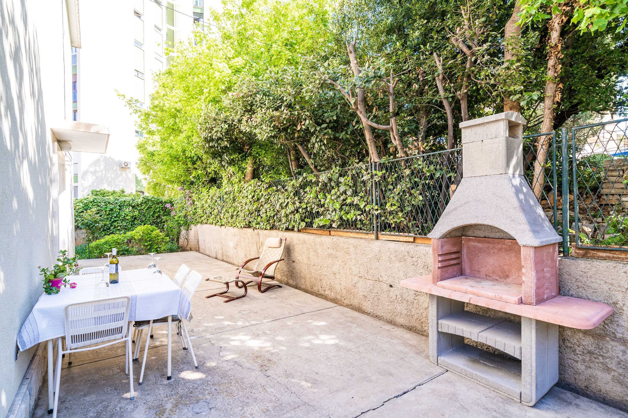 Ground floor: (Living room(TV, seating area), Kitchen(dining table, coffee machine, oven, microwave, fridge, freezer), bedroom(double bed), bedroom(2x single bed), bathroom(toilet, shower, washing machine))\n\nguest toilet, air conditioning, terrace, garden, BBQ, parking, ironing board, iron, hairdryer