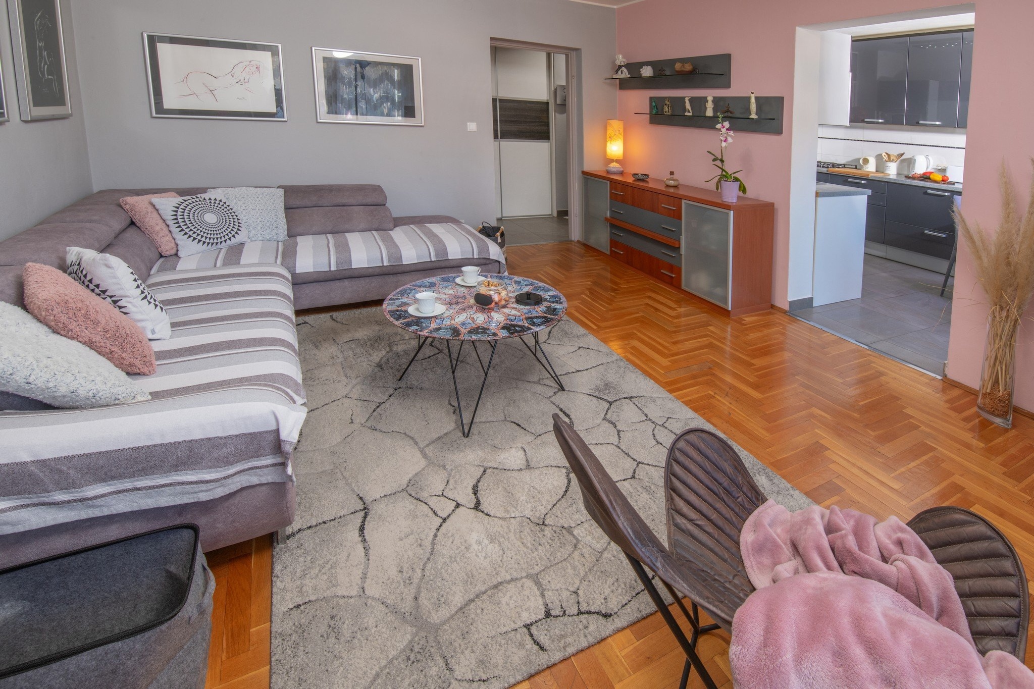 On the 1st floor: (Living room(TV), Kitchen(dining table, stove, seating area, electric kettle, toaster, hood, coffee machine, oven, microwave, dishwasher, fridge, freezer), bedroom(double bed), bedroom(double sofa bed), bathroom(toilet, shower, washing machine))\n\ndining room, guest toilet, cot, balcony, air conditioning, parking lot(public), ironing board, iron, hairdryer