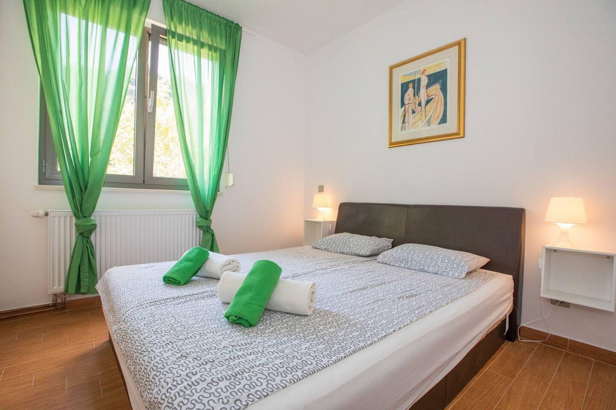 Ground floor: (Living room(TV, dining table, seating area), Kitchen(stove, electric kettle, toaster, oven, microwave, dishwasher, fridge, freezer), bedroom(double bed), bathroom(toilet, shower))\n\ndining room, cot, air conditioning, terrace, garden, parking, ironing board, iron, hairdryer