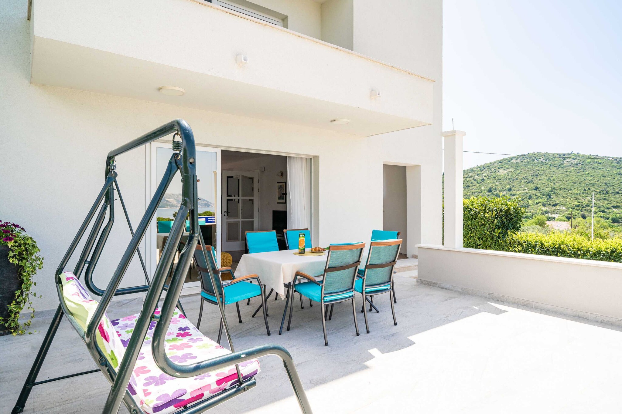 Ground floor: (open kitchen(toaster, hood, oven, dishwasher, fridge, freezer), Living/bed room(double sofa bed, TV, dining table, seating area), bedroom(double bed), bedroom(2x single bed), bathroom(toilet, bath tub))\n\nwashing machine, air conditioning, terrace, parking, ironing board, iron, hairdryer