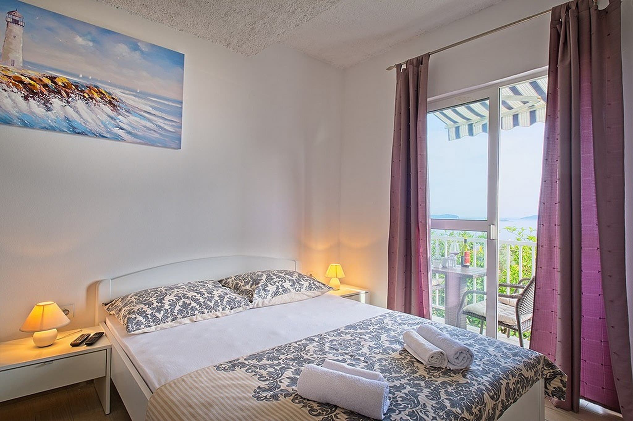 On the 1st floor: (Kitchenette(dining table, seating area, electric kettle, fridge, freezer), Living/bed room(single bed, double bed, TV), bathroom(toilet, shower))\n\ncot, balcony, air conditioning, parking, iron, hairdryer