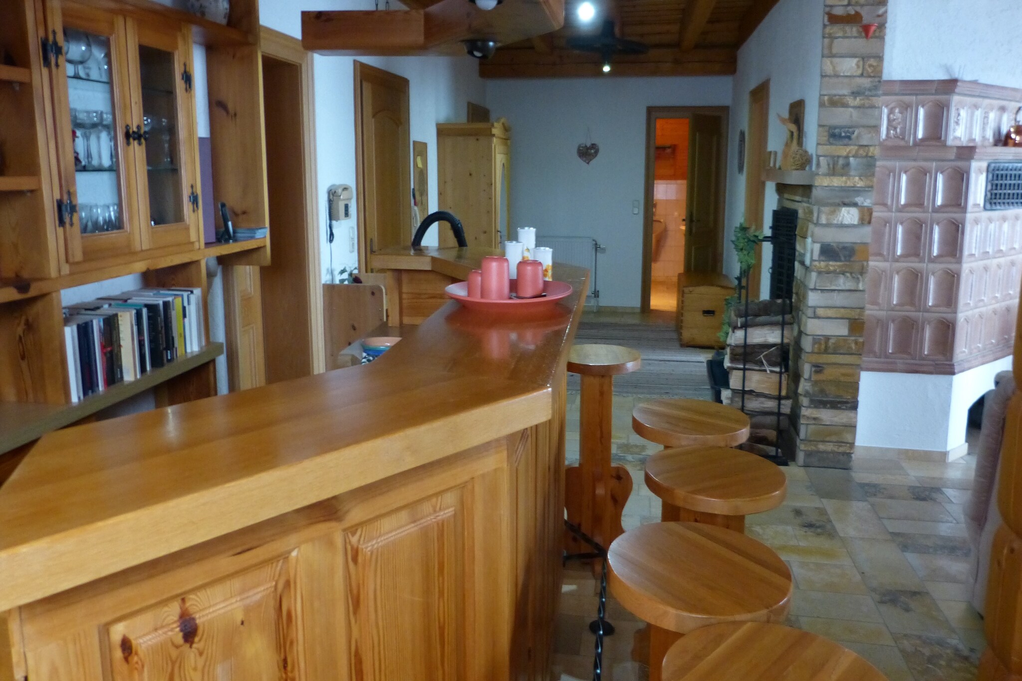 This cozy first-floor apartment in Zenting offers a relaxing stay for couples or small families. It features two bedroomsâ€”one with a double bed and the other with twin singles, a spacious living/dining room with satellite TV, seating area, and a bar, plus a fully equipped kitchen with ceramic stove, combination microwave, and coffee machine. The bathroom includes a bathtub, shower, toilet, and urinal, while central heating and a fireplace ensure year-round comfort.

Guests can enjoy a private balcony, shared garden with barbecue, deckchairs, and on-site parking. The layout is ideal for unwinding after a day of exploring, with thoughtful touches like a toaster, fridge-freezer, and outdoor seating. Whether you're preparing meals or enjoying the fresh Bavarian air, this apartment blends simplicity with charm.

Nearby, visit the scenic Brotjacklriegel summit with its wooden observation tower, or explore the interactive trails of Nationalpark Bayerischer Wald just 10 km away. Families will love Pullman City Westernstadt, a Wild West theme park, while culture lovers can explore the historic city of Passau. For dining, try Cafe Daxstein for local treats or head to Zum Fernblick for hearty Bavarian fare with panoramic views.