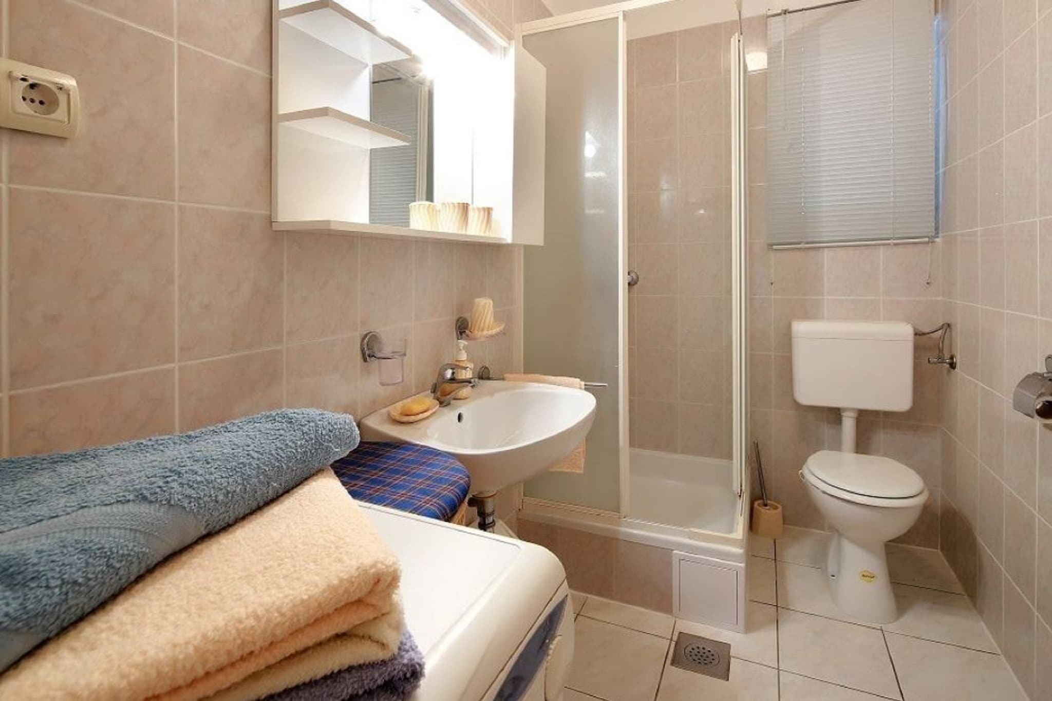 On the 2nd floor: (open kitchen(hob, electric kettle, oven, microwave, fridge-freezer, washbasin), Living/diningroom(double sofa bed, TV, dining table), bedroom(double bed), bathroom(shower, washbasin, toilet, washing machine), air conditioning)\n\nbalcony or terrace, parking