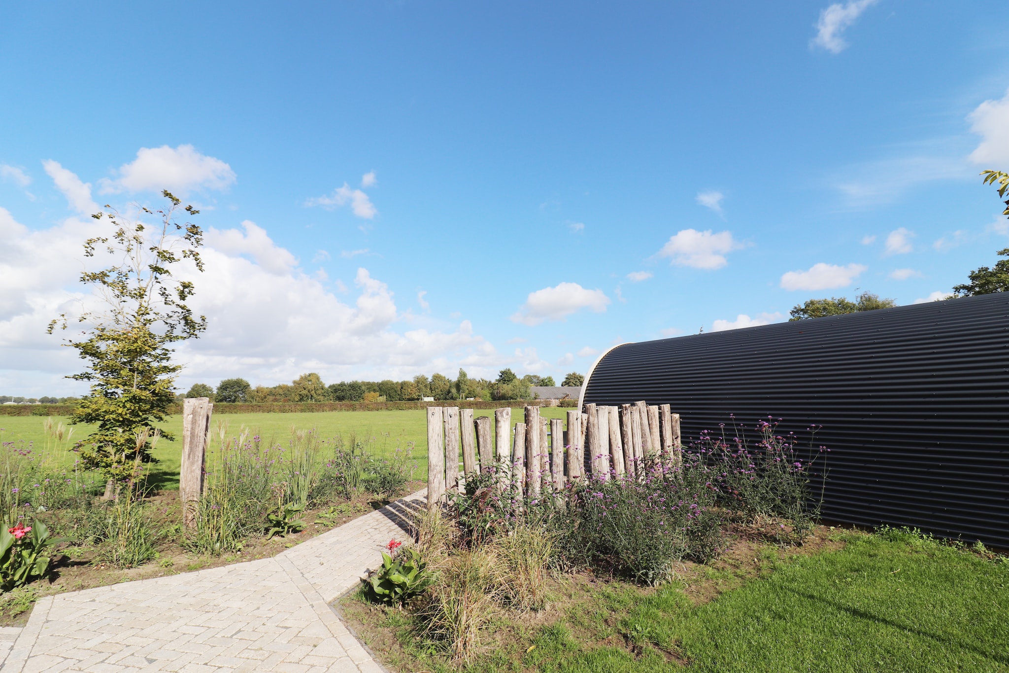 Natuurlodge Graspieper 2p - Buitenkant zomer
