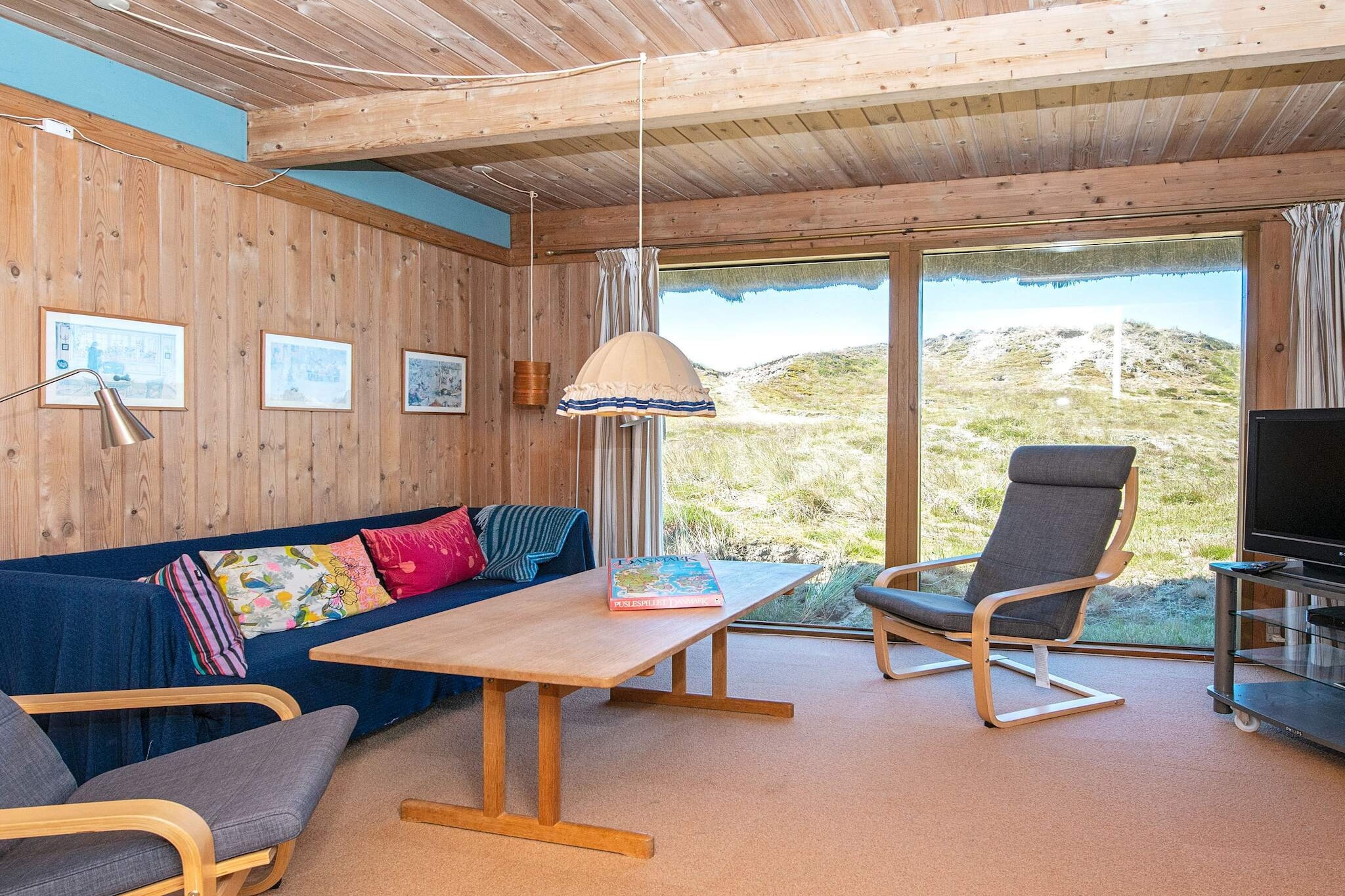 Holiday home situated on a large natural plot near the dunes at SÃ¸nderho. The house features an open kitchen connected to the dining area and living room, creating a spacious and welcoming environment for family life. From the living room, you can step directly onto the terrace, where you can enjoy long, peaceful summer evenings while taking in the natural surroundings.

The property offers a charming combination of indoor and outdoor spaces, ideal for relaxation and spending quality time with family or friends. The open-plan living area is bright and comfortable, perfect for dining, socializing, or simply unwinding after a day exploring the nearby beaches.

SÃ¸nderho itself is a picturesque village with historic sailor houses, narrow paths, and winding streets that resemble a small labyrinth, making it a delightful place to explore on foot. The surrounding area provides ample opportunities for walking and cycling amid scenic landscapes, dunes, and coastal paths.

This holiday home is perfect for guests who enjoy tranquility, nature, and the charm of a traditional North Sea coastal village. The large natural plot ensures privacy, space for outdoor activities, and a peaceful setting for relaxation. Families will appreciate the safe and open environment for children to play, while adults can enjoy the serenity of the dunes and fresh sea air.

No rentals to youth groups, please.