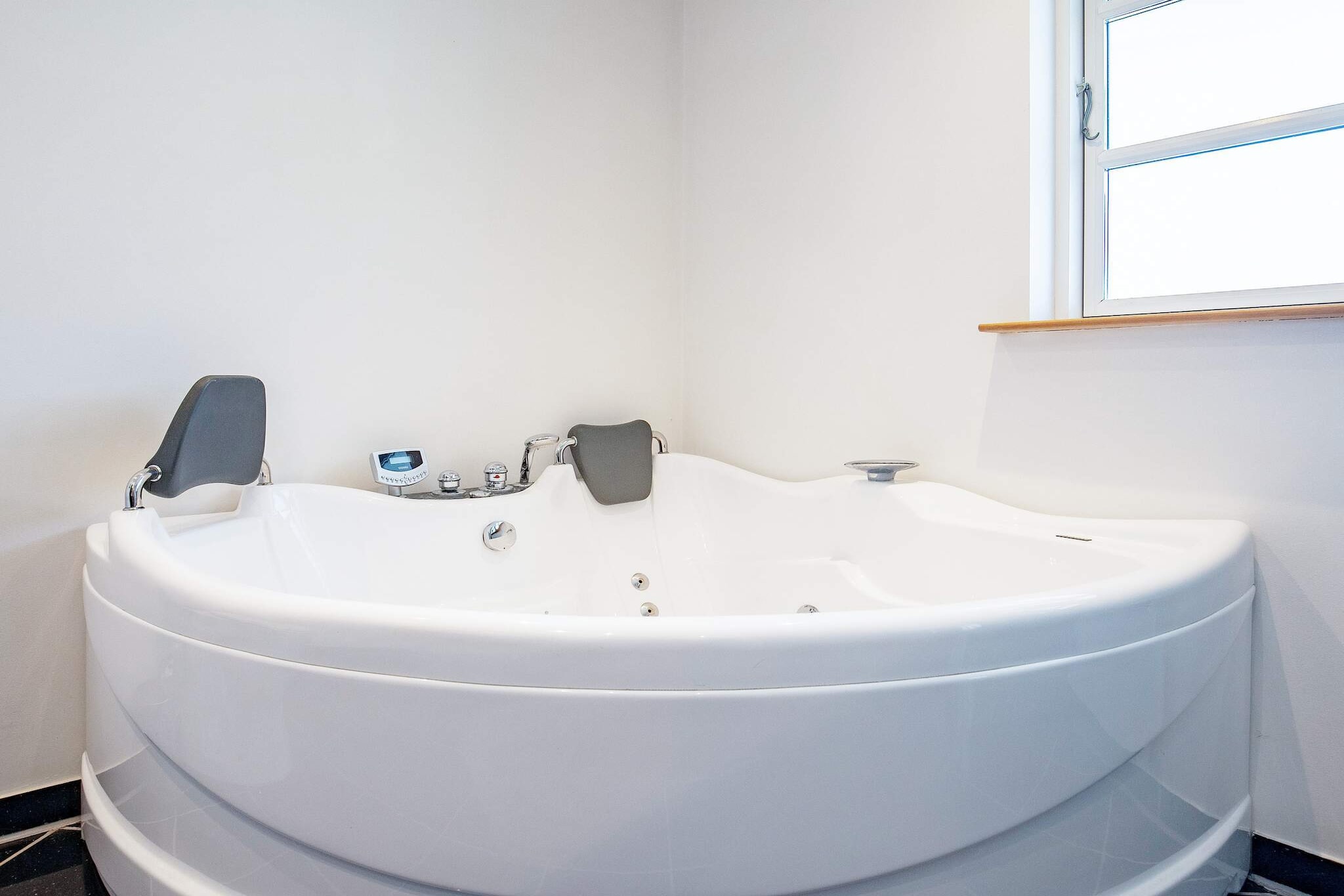 This charming holiday home near Næsby Strand on the island of Lolland is the perfect retreat for two guests, just 400 meters from the beach. Designed for comfort and relaxation, the property features a spacious open-plan kitchen connected to the living and dining area, complete with a cozy wood-burning stove. The bathroom offers a whirlpool, shower, and underfloor heating, providing the perfect setting for unwinding after a day outdoors. A practical utility room with washing machine, dryer, and ample storage for clothes and shoes adds convenience for longer stays. The bedroom is equipped with a height-adjustable double bed, ensuring a restful night’s sleep. For entertainment, the home includes a billiard table and a TV with Chromecast for streaming your favorite content, making it ideal for cozy indoor evenings. Large windows and easy access to the outdoors create a bright and inviting living space. Outside, terraces on both sides of the house provide plenty of room to enjoy the sun, host barbecue evenings, or simply relax while taking in the peaceful surroundings. The nearby sandy beach is within walking distance, offering opportunities for swimming, sunbathing, and seaside walks. With its combination of comfort, entertainment options, and proximity to the beach, this holiday home provides a memorable getaway for couples seeking both relaxation and fun. Please note: rental to youth groups is not permitted.A refundable deposit might be charged closer to your check-in date. The security deposit ensures a smooth stay and covers any additional services or consumption charges.This deposit covers utilities consumed during your stay and any additional services that may be taken.The final amount will be adjusted based on actual meter readings, actual usage of extra services, and any remaining balance will be refunded within 21 days after checkout.This deposit simply acts as a prepayment for charges that  you would anyways pay for, ensuring a seamless stay and check-out experience.