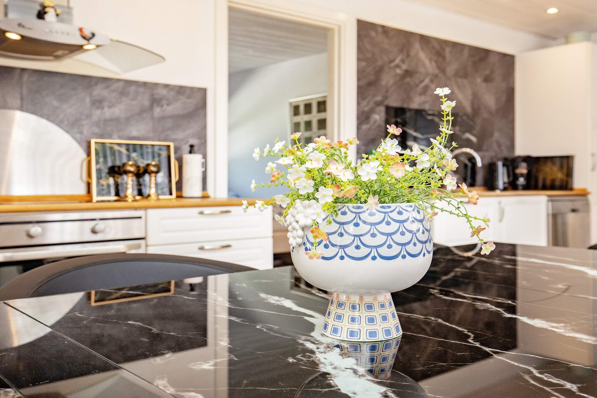 Kitchen(cooker(electric), hood, coffee machine, microwave, dishwasher, fridge(+ freezer)), Living/bed room(TV(german television channels, danish TV channels (DR1 and TV2)), high chair, chromecast), bedroom(double bed, children\'s bed), bedroom(single bed, double bed), bathroom(floor heating)(tumble dryer, washbasin, shower, toilet, washing machine), coffee machine, Bubble bath(indoor, heated, 2 persons), heating(electric), terrace, garden, play equipment, billiards, air to air heatpump