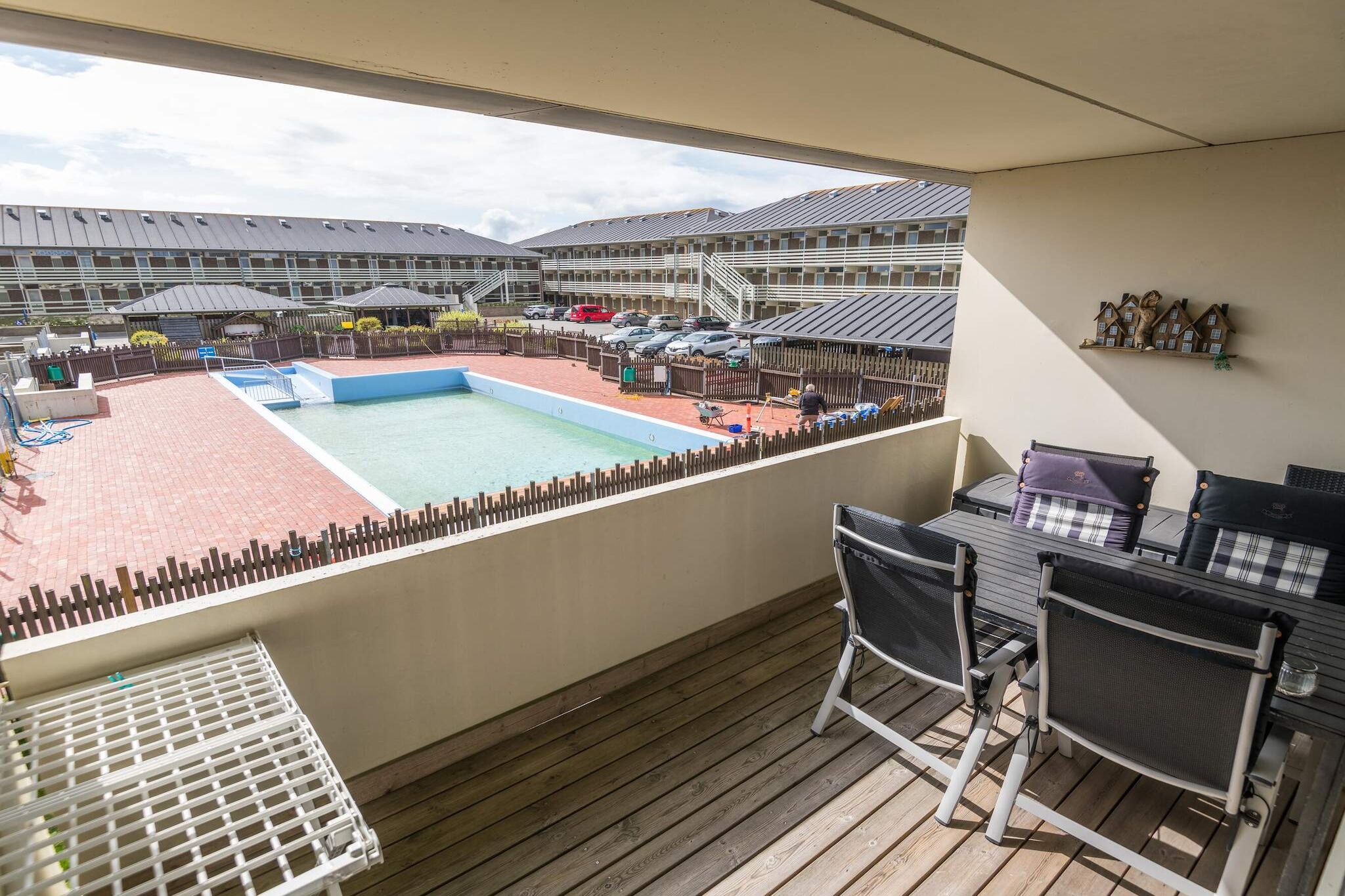 This beautifully furnished first-floor holiday apartment on Fanø offers a bright and welcoming retreat, ideal for families or small groups. The apartment features two comfortable bedrooms and a spacious open-plan kitchen and living area, perfect for preparing meals, relaxing, and spending quality time together. From the balcony, guests can enjoy peaceful views of the communal outdoor pool, creating a serene setting for morning coffee or quiet evenings. Guests have access to a variety of shared facilities on site, including a barbecue hut, outdoor pool, sauna, and a playroom, ensuring fun and relaxation for all ages. The apartment’s thoughtful interior design and convenient layout make it easy to unwind indoors, while the outdoor amenities provide opportunities for socializing, games, or soaking up the sun. This combination makes the property ideal for both relaxing retreats and activity-filled family holidays. The location is perfect for seaside enjoyment, with the beach just steps away and a nearby golf course offering additional leisure options. Whether you wish to stroll along the coast, enjoy water activities, or explore the charming island of Fanø, this apartment serves as an ideal base. Final cleaning is included, so guests can arrive and settle in without any worries, allowing for a truly carefree and memorable holiday experience.A refundable deposit might be charged closer to your check-in date. The security deposit ensures a smooth stay and covers any additional services or consumption charges.This deposit covers utilities consumed during your stay and any additional services that may be taken.The final amount will be adjusted based on actual meter readings, actual usage of extra services, and any remaining balance will be refunded within 21 days after checkout.This deposit simply acts as a prepayment for charges that  you would anyways pay for, ensuring a seamless stay and check-out experience.