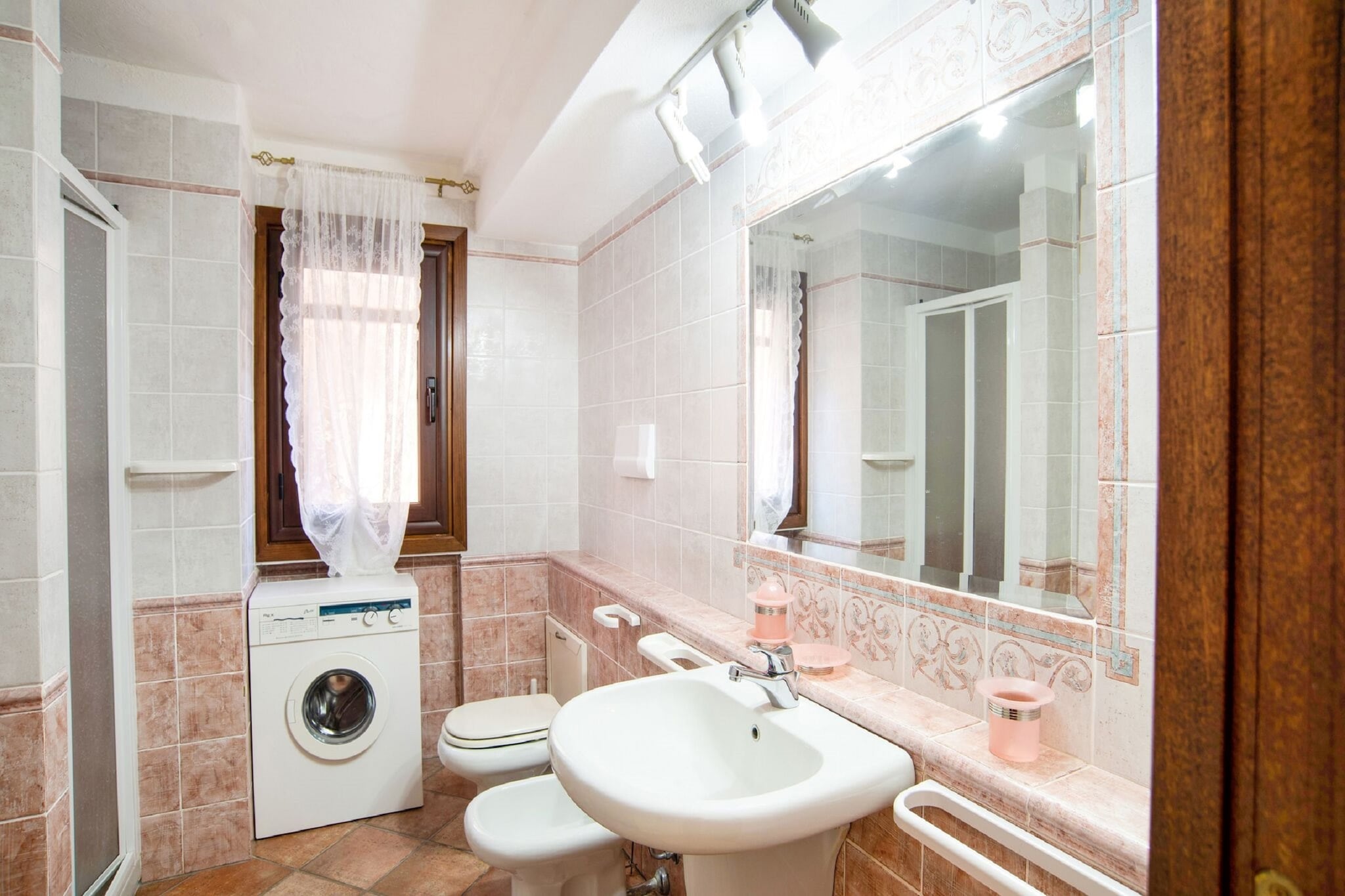 mezzanine: (Living room(TV, dining table, seating area), open kitchen(hob, electric kettle, hood, fridge, washbasin), bedroom(double bed), bedroom(single bed, single bed), bedroom(double bed or 2 single beds), bathroom(shower, washbasin, toilet), bathroom(bathtub with shower, washbasin, toilet, washing machine), air conditioning)\n\nbalcony or terrace, parking