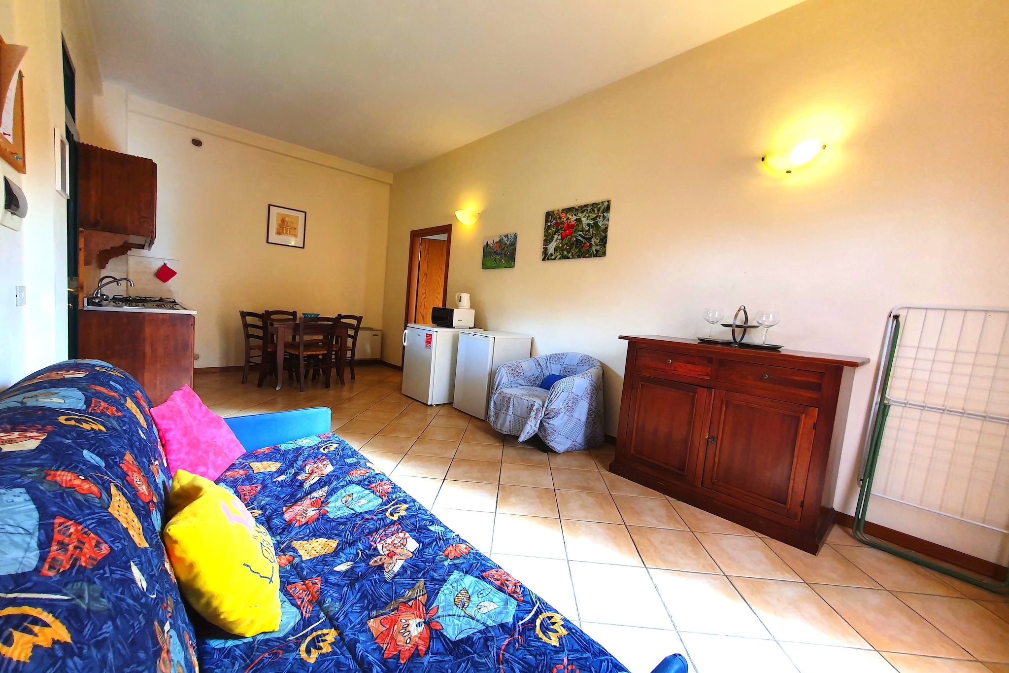 A cosy mansion perched in the hills amid lush greenery awaits you in Siena and has 1 bedroom which can accommodate 4 people, ideally a family with children or a small group travelling together. A huge swimming pool, shared with other guests, open from May till September, beckons you to this cosy home complete with all basic necessities and more.

Supermarkets lie 2 km away from your stay, so fetching general supplies is hassle-free. Restaurants for experiencing fine dining can be reached easily as well 3 km away. A bit farther is the Duomo di Siena with its all-around gothic beauty and picturesque mosaics. At 7 km is the historic centre of Siena, the Piazza del campo, where you can be a part of public celebrations. Gaia Fountain with its architectural integrity is equidistant and is a must-visit. 

Enjoy the spectacular view from the patio as you savour your morning coffee and relish barbecues in the evenings. Washing facilities are available. Keep in mind that the sofa bed is suitable for children under 12 not for adults

Siena Airport lies 14 km away.


