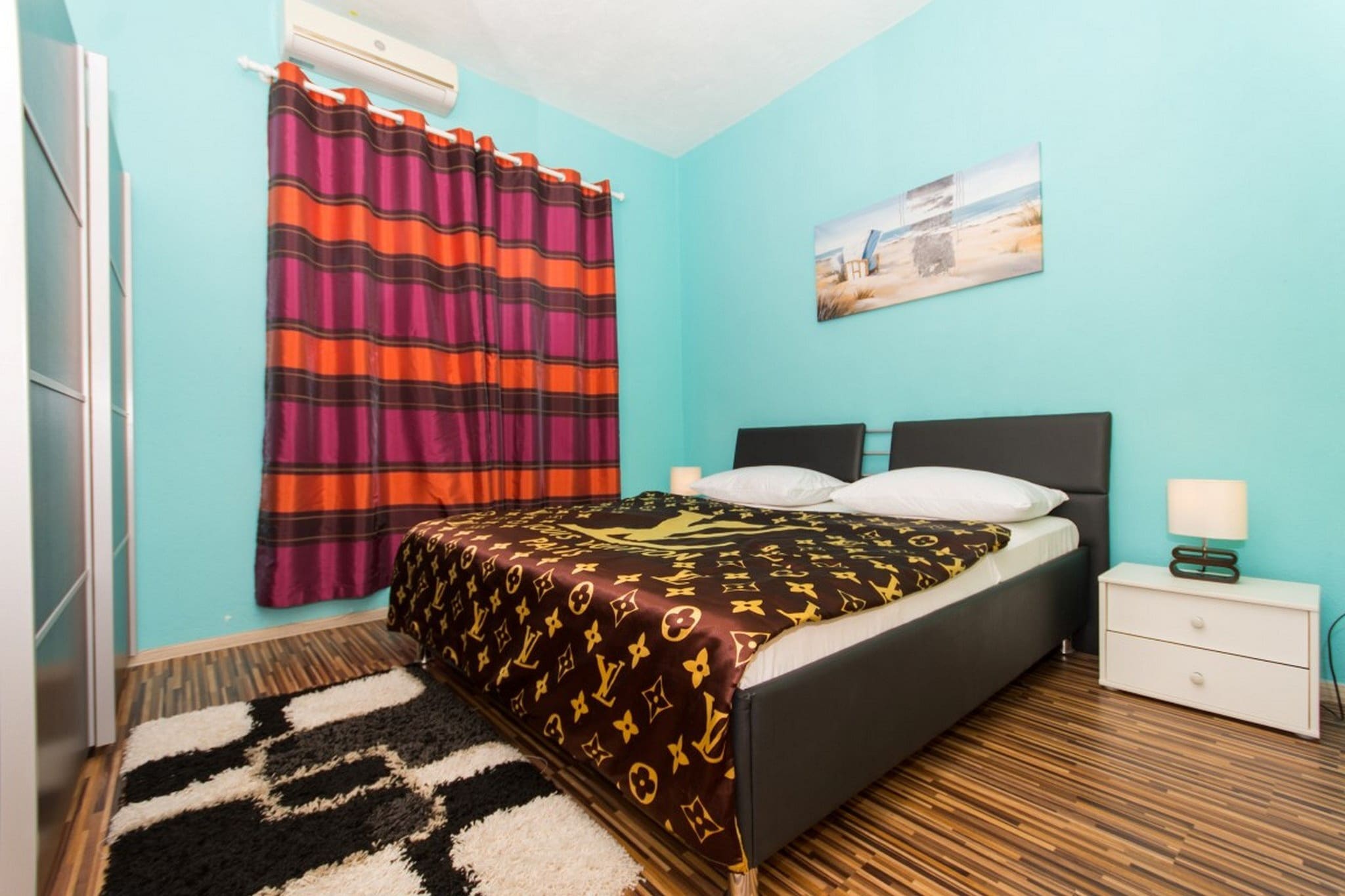 Ground floor: (Living room(TV, dining table, seating area), Kitchen(hood, oven, dishwasher, fridge, washing machine), bedroom(double bed), bedroom(double bed), bathroom(washbasin, toilet), bathroom(toilet, shower))\n\ncot, air conditioning, terrace, sun loungers, parking, swimming pool, ironing board, iron, hairdryer